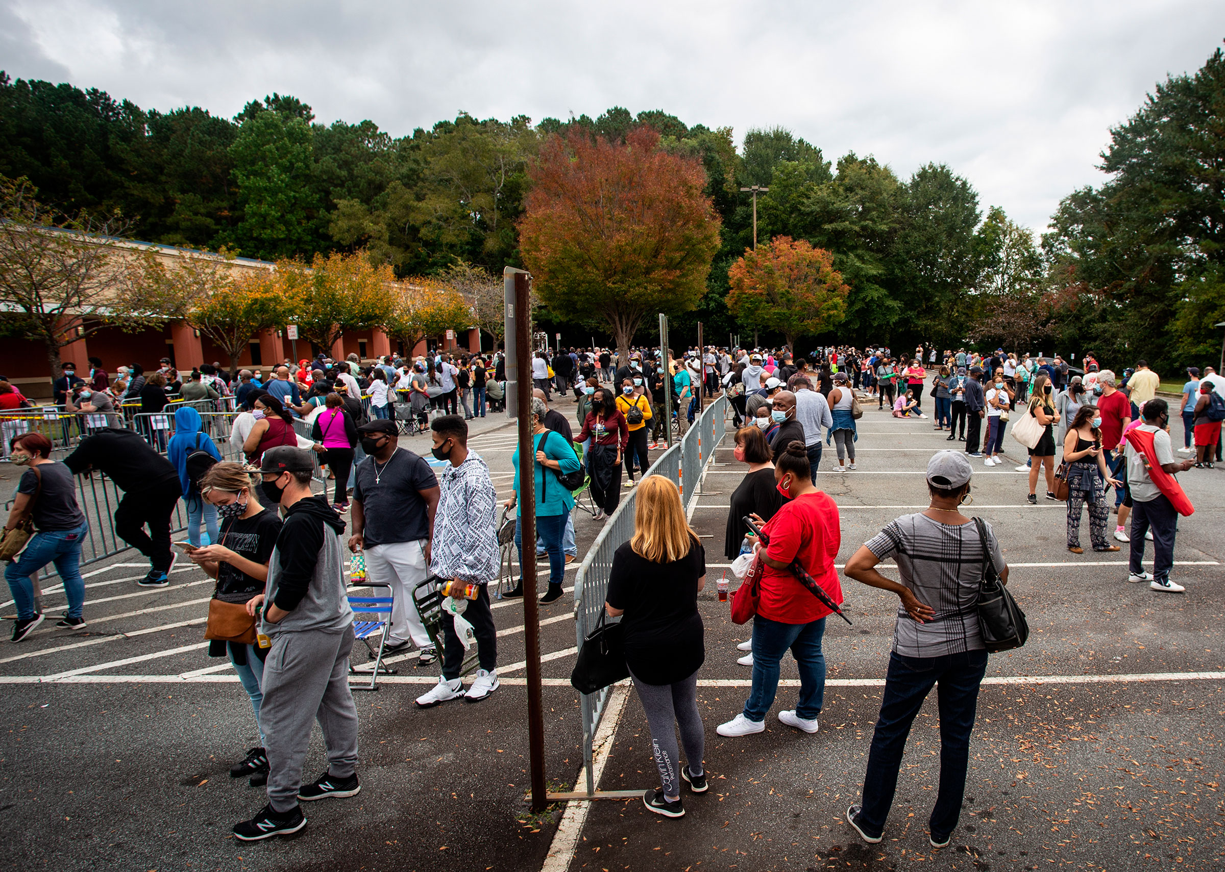 Hundreds of people wait in line to vote early in the general election in Marietta, Georgia, on October 12. Marietta is located in Cobb County.