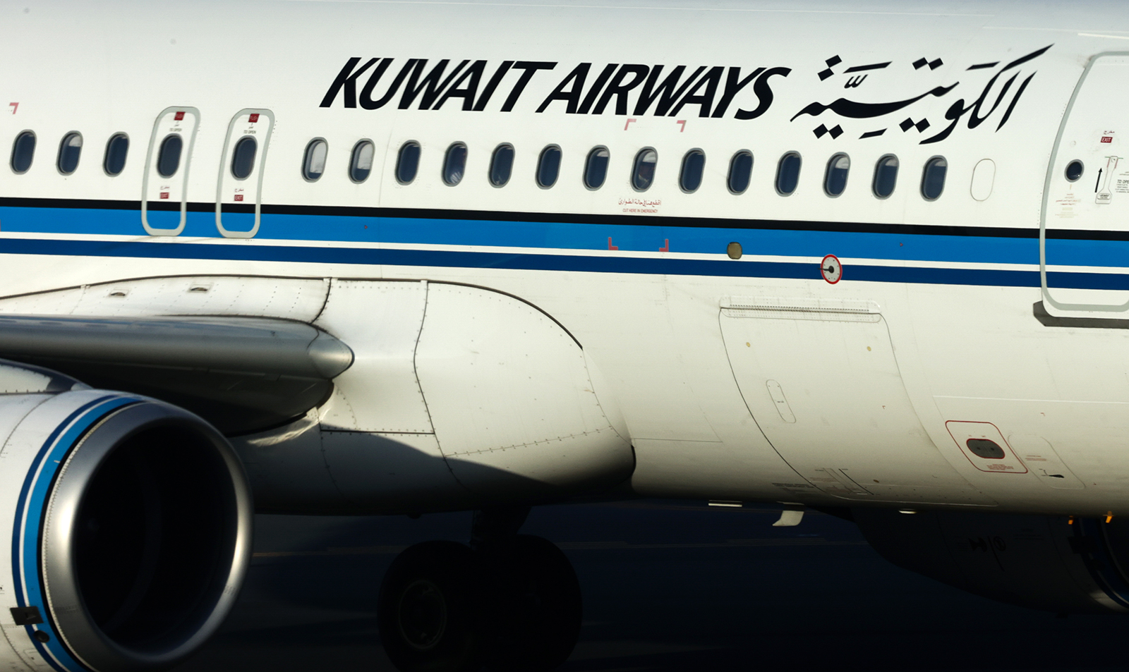 A Kuwait Airways plane is seen on the runway last month at an airport in Bahrain.