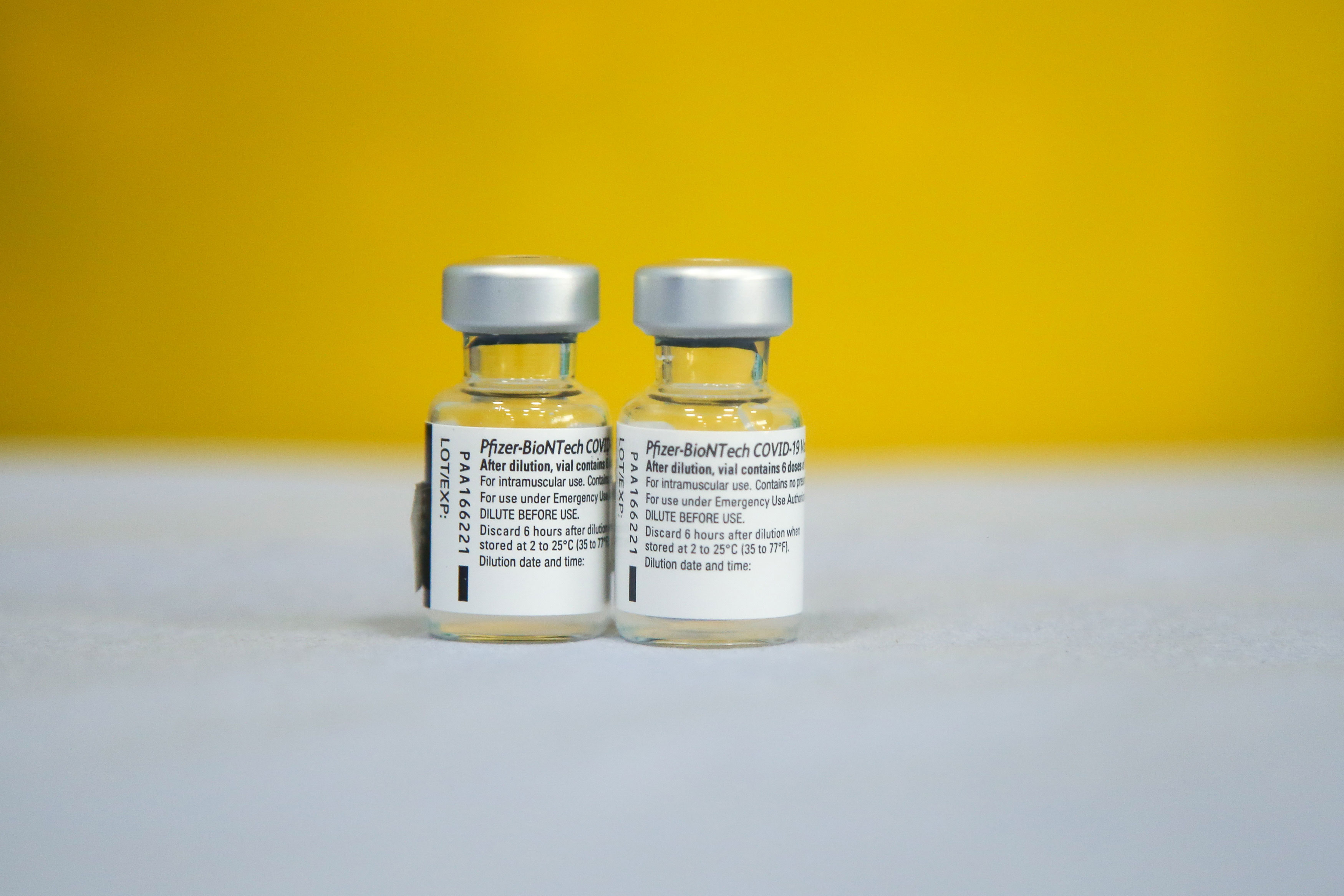 Vials containing the Pfizer-BioNTech Covid-19 vaccine are pictured in London on June 14, 2021.