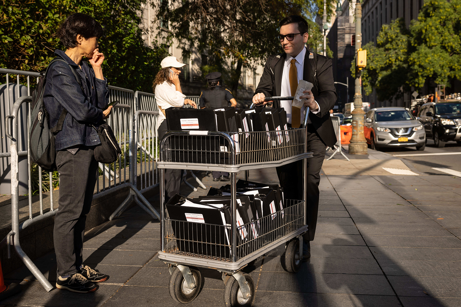 A court clerk pushes United States v. Samuel Bankman-Fried documents outside court in New York, on October 3.