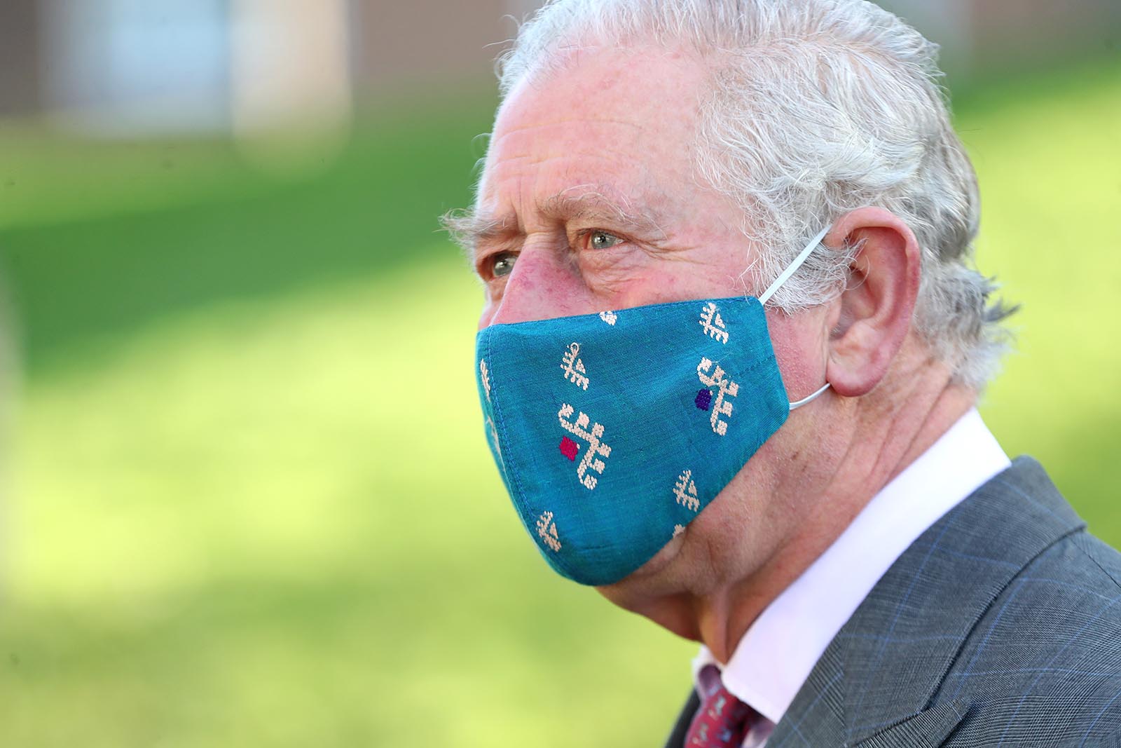 Prince Charles wears a face mask during a visit to Gloucestershire Vaccination Centre at Gloucestershire Royal Hospital on December 17, 2020 in Gloucester, England.