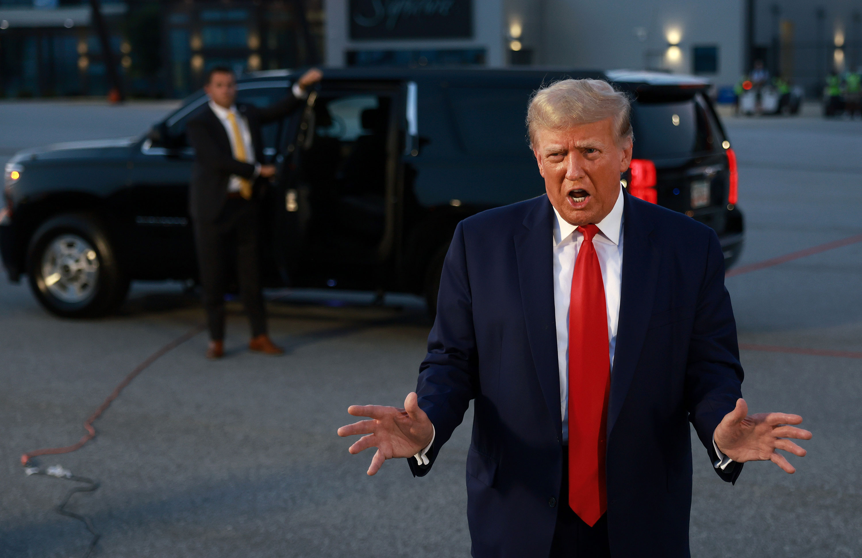 Former President Donald Trump speaks to the media at Atlanta Hartsfield-Jackson International Airport on Thursday.