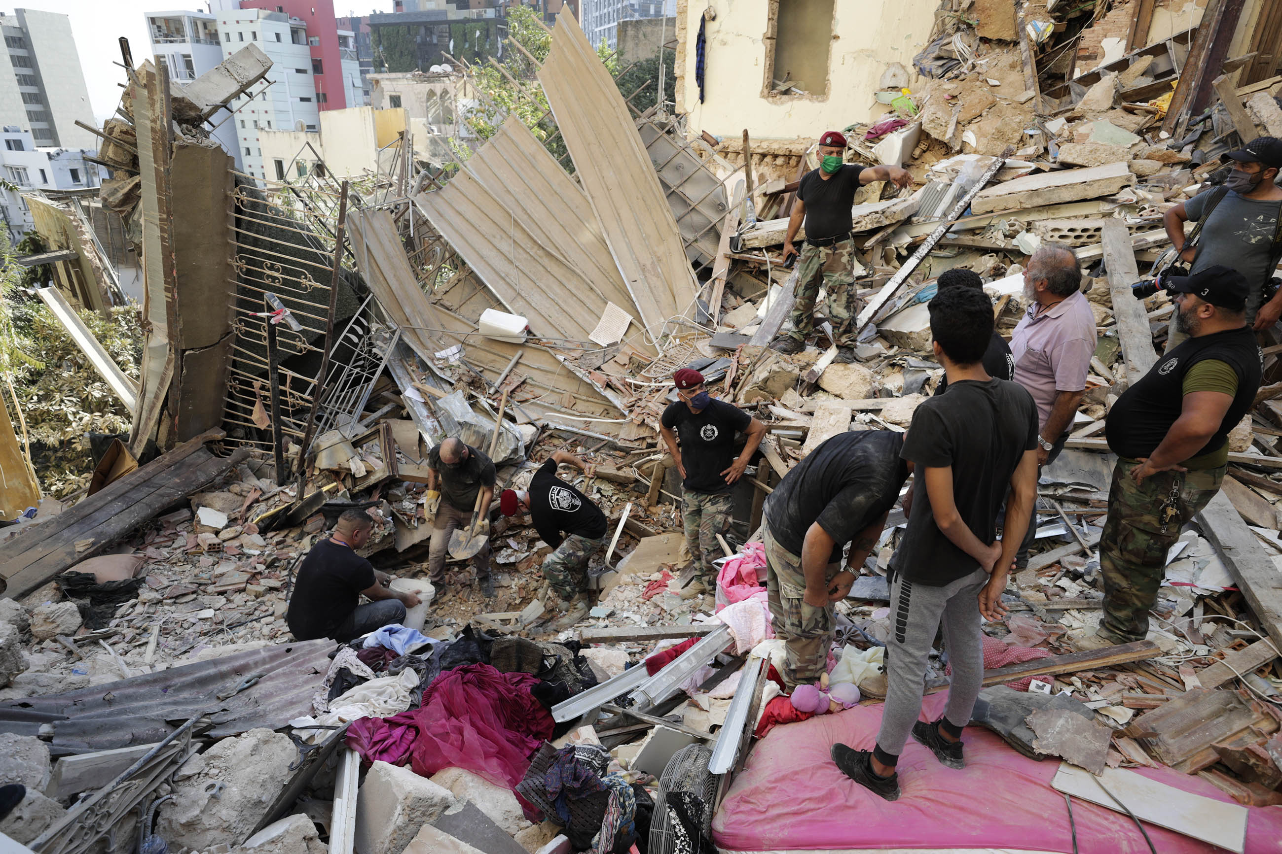 Lebanese soldiers search for survivors after a massive explosion in Beirut, Lebanon, on Wednesday, August 5. 