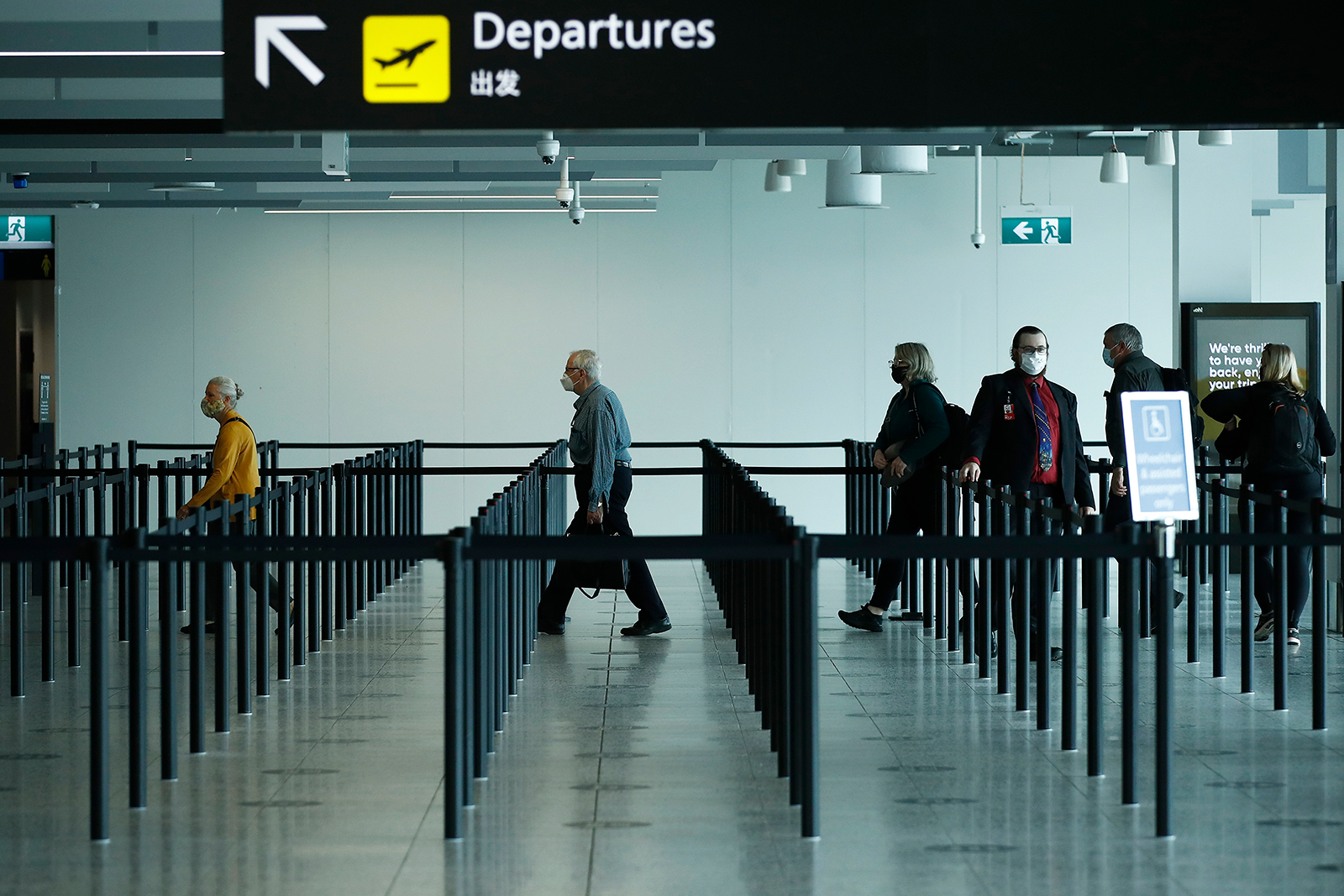 People are seen at Melbourne airport checking in for flights to New South Wales on November 23.