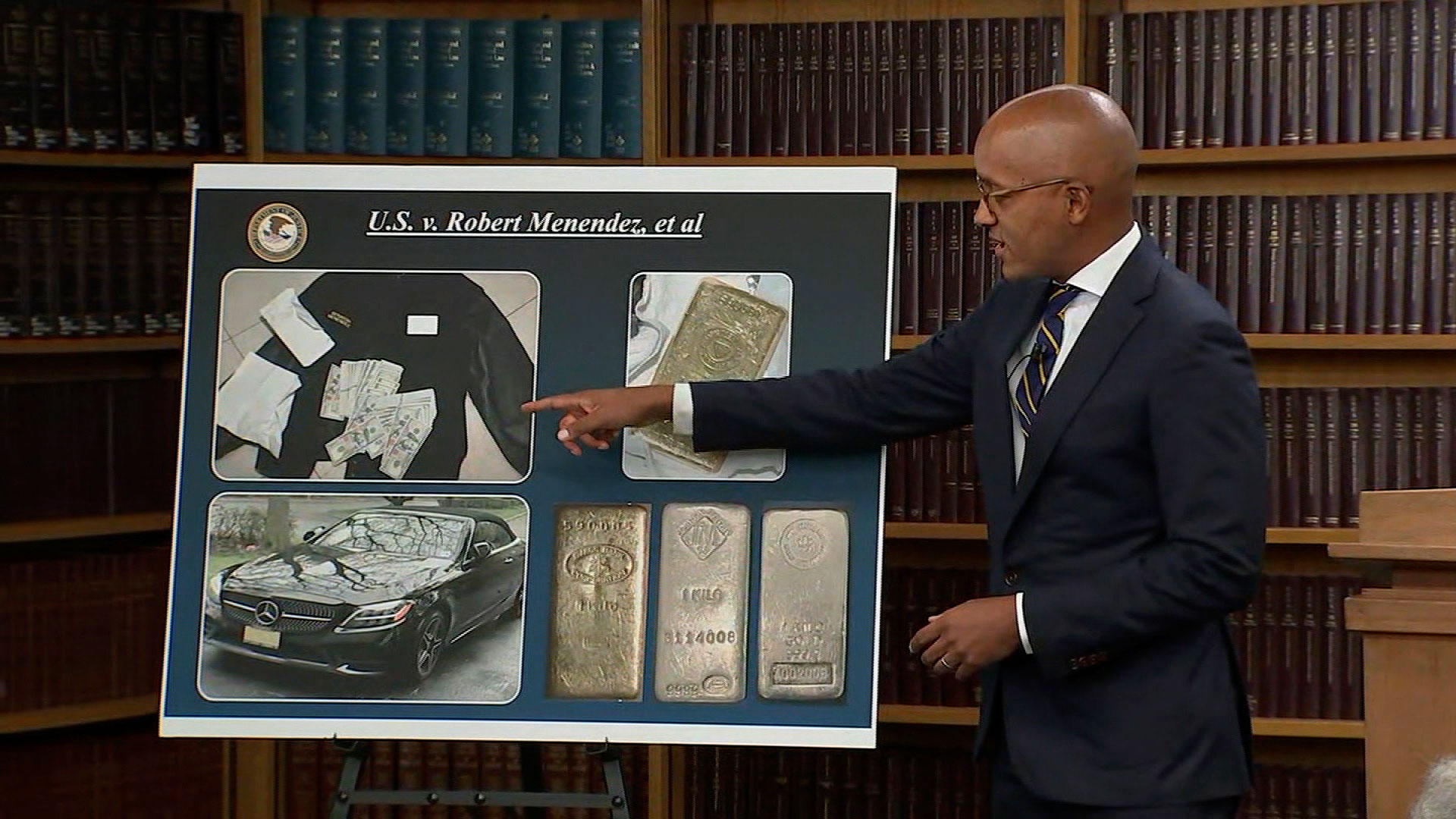 Damian Williams, US Attorney for the Southern District of New York, shows photos o