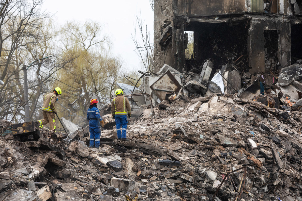 Rescuers search for victims in the rubble of two high-rise apartment buildings in Borodianka on April 11.