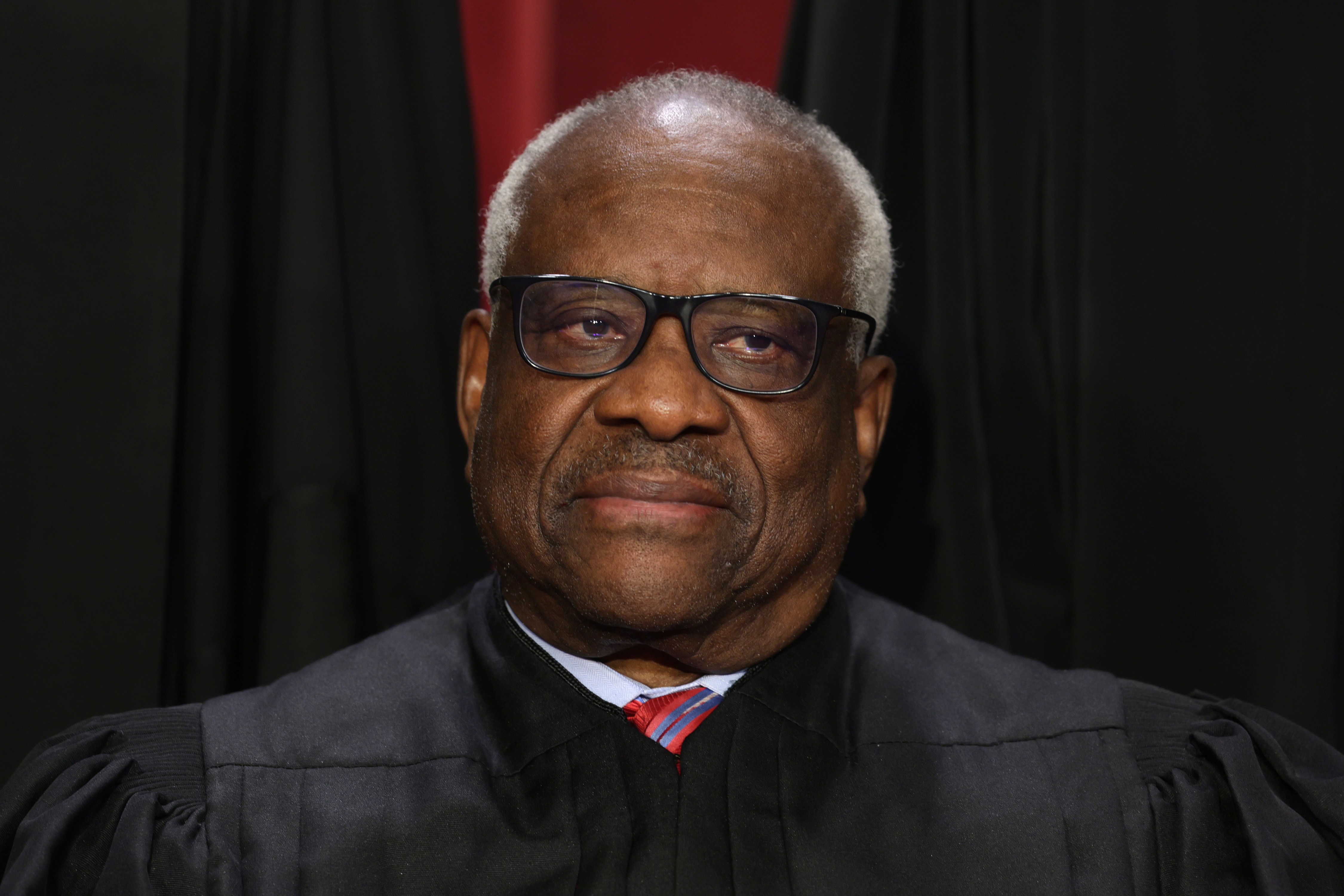 Justice Clarence Thomas poses for an official portrait at the Supreme Court in Washington, DC, in 2022.