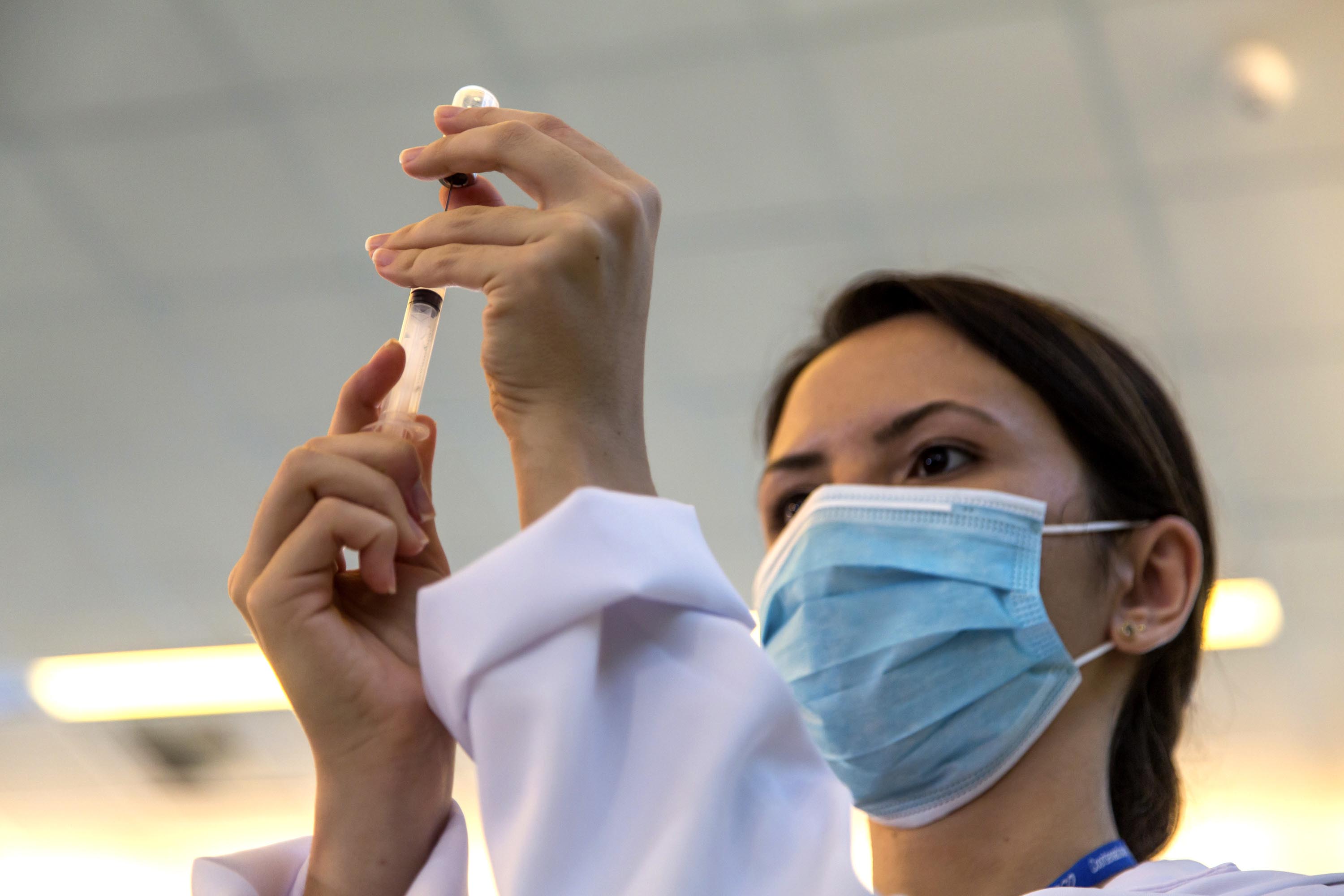 A nurse prepares a shot of the vaccine produced by China’s Sinovac Biotech, at a hospital in São Paulo, Brazil, on Sunday. 