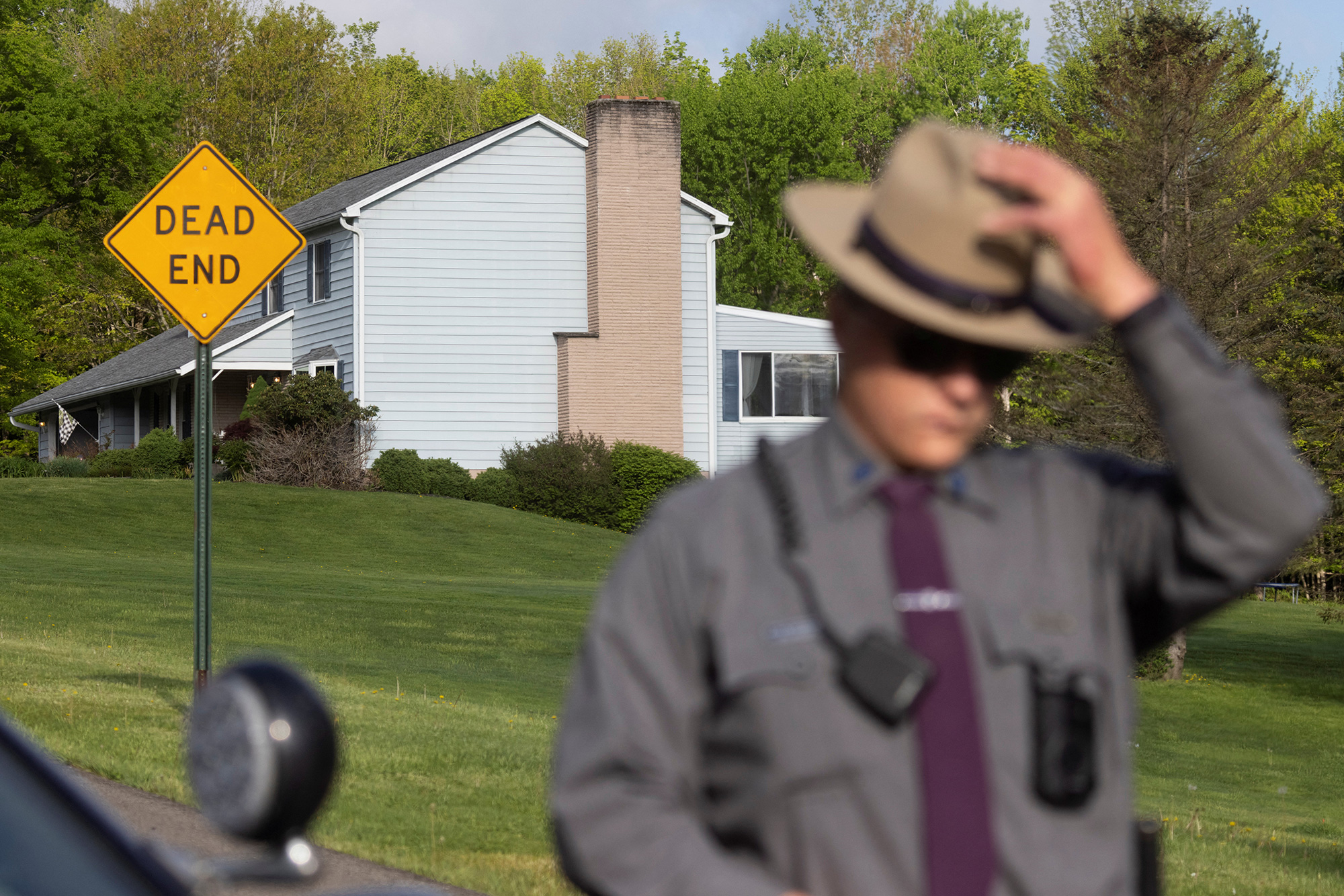 Law enforcement personnel are seen at the home of Buffalo supermarket shooting suspect Payton Gendron in Conklin, New York, on May 15.