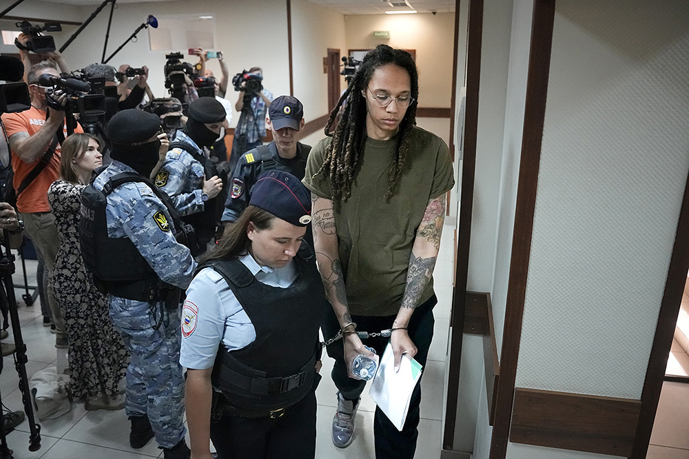 WNBA star and two-time Olympic gold medalist Brittney Griner is escorted to court prior to a hearing in Khimki, just outside Moscow, Russia, on August 2.