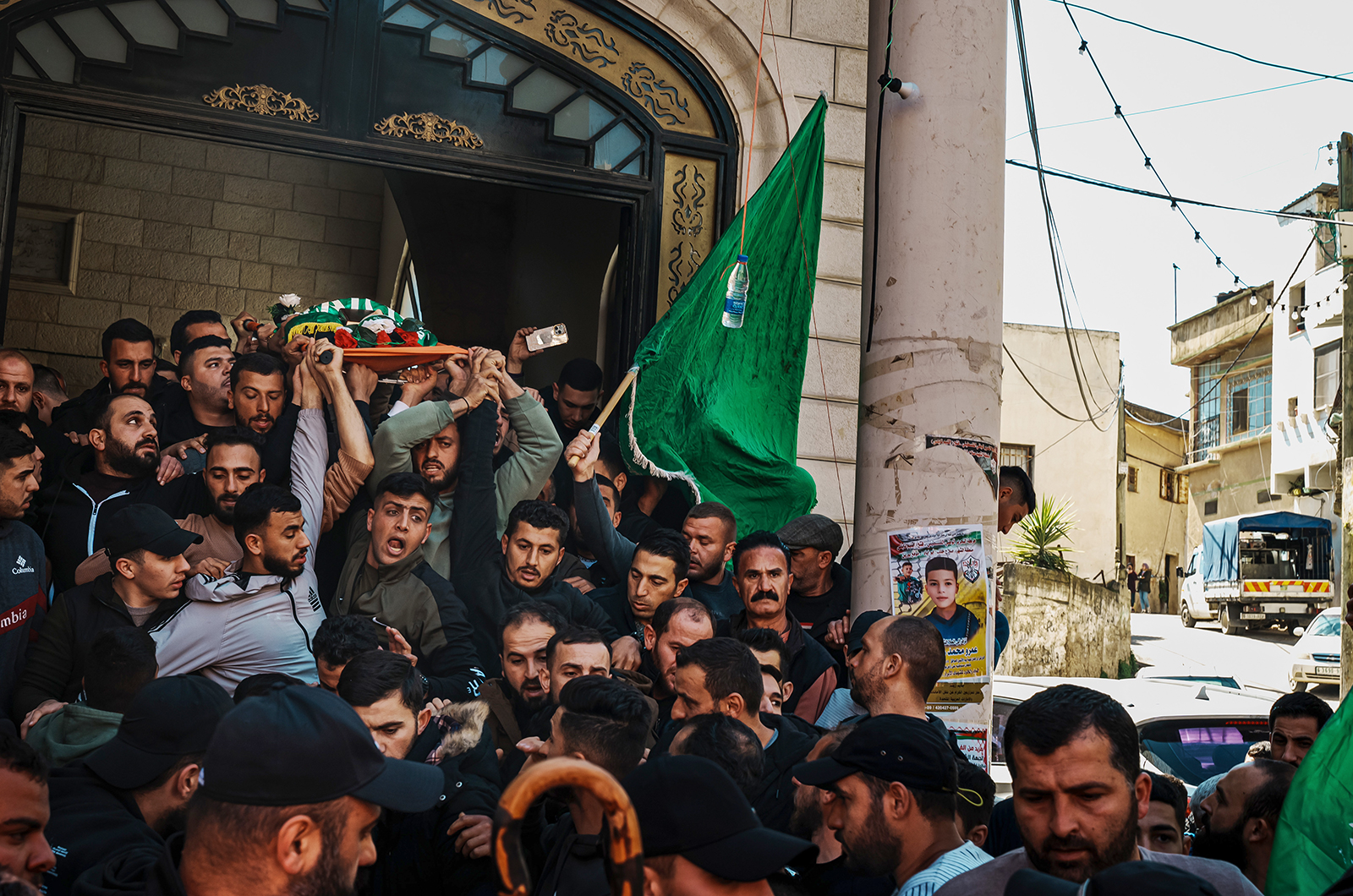 Community members and relatives carry the body of 10-year-old Amro Najjar, who was killed by Israeli forces, during a funeral procession at a mosque in Burin in the occupied West Bank on March 5.