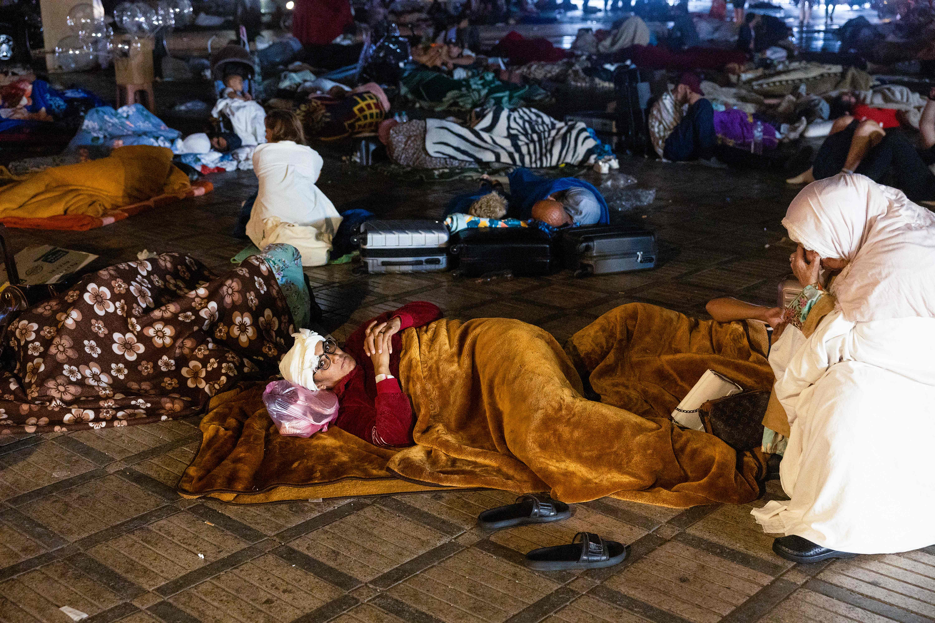 Residents stay outside at a square on September 9.