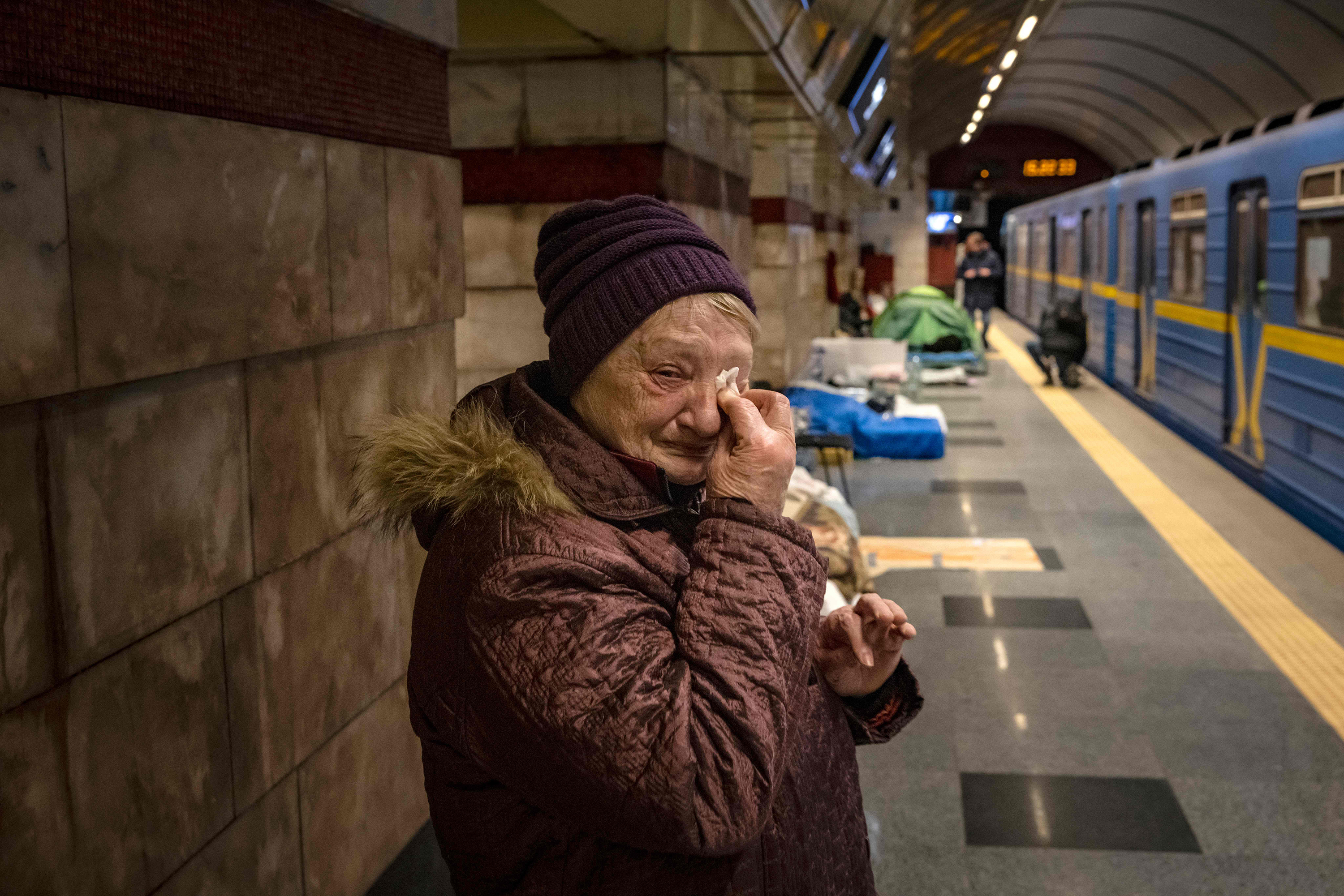 A woman cries as she takes refuge in a metro station being used as bomb shelter in Kyiv, Ukraine on March 18.