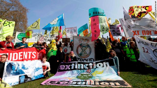 Demonstrators gather during a climate protest in Parliament Square in London on Monday.
