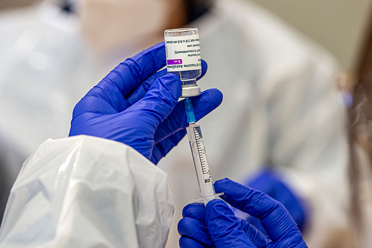 A health technician loads up a syringe with a dose of the AstraZenecas COVID-19 vaccine on the day in which health personnel in line for immunity are being inoculated with the AstraZeneca vaccine at Multiusos de Gondomar on February 12, 2021 in Gondomar, Portugal. 