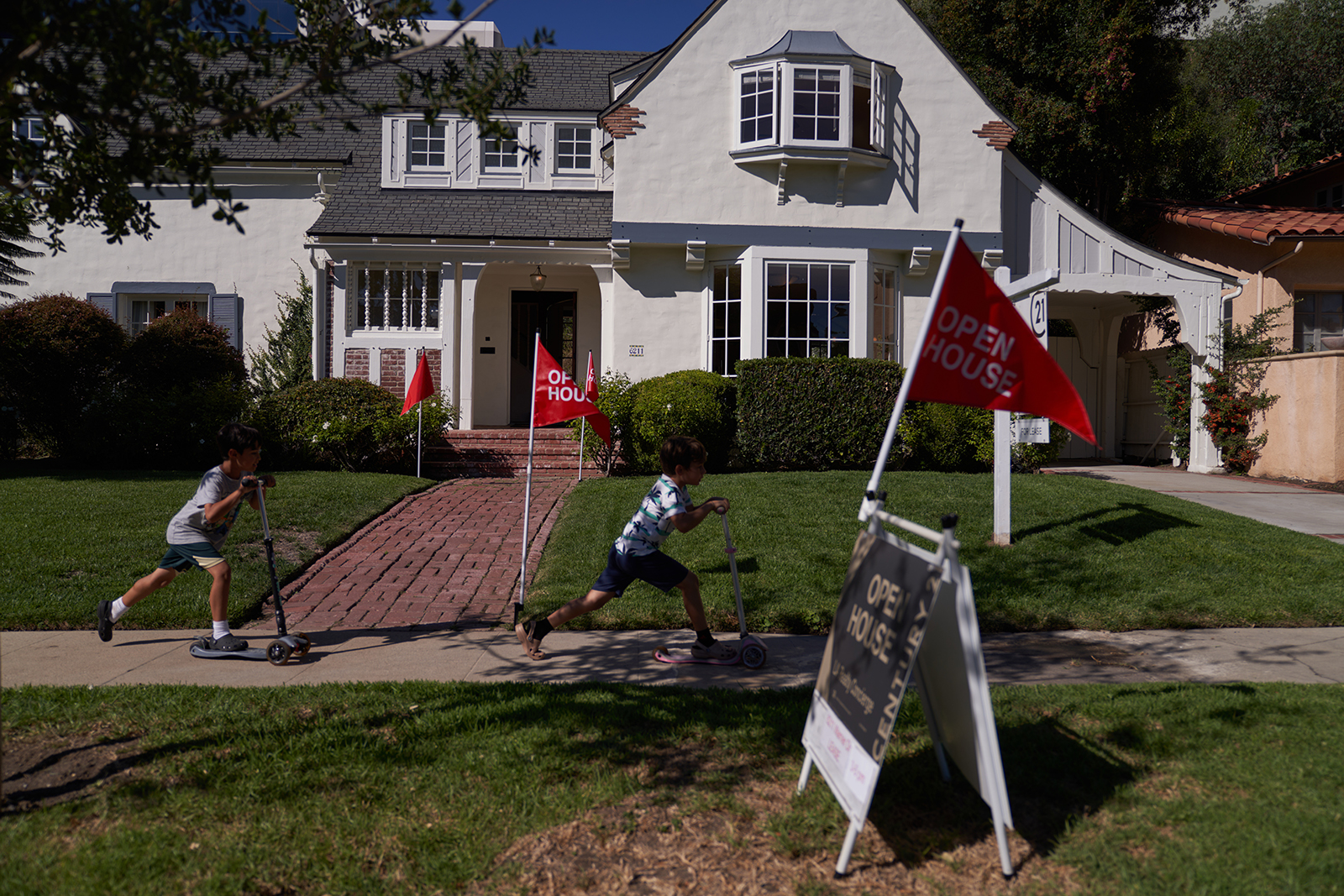 'Open house' flags are displayed outside a single family home on September 22, 2022 in Los Angeles, California. 