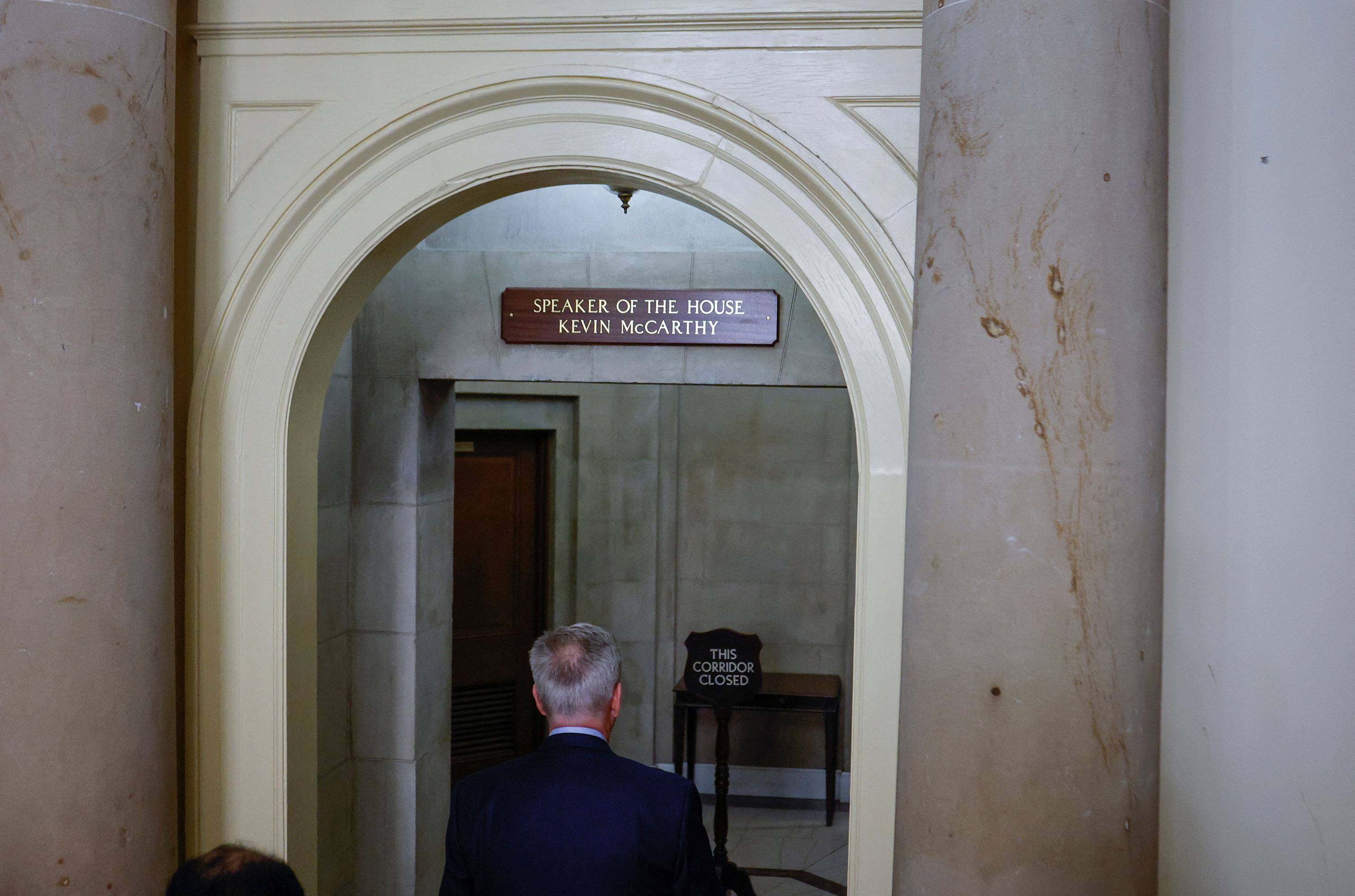 Former Speaker of the House Kevin McCarthy walks back into the office of the Speaker of the House after holding a press conference Tuesday night.