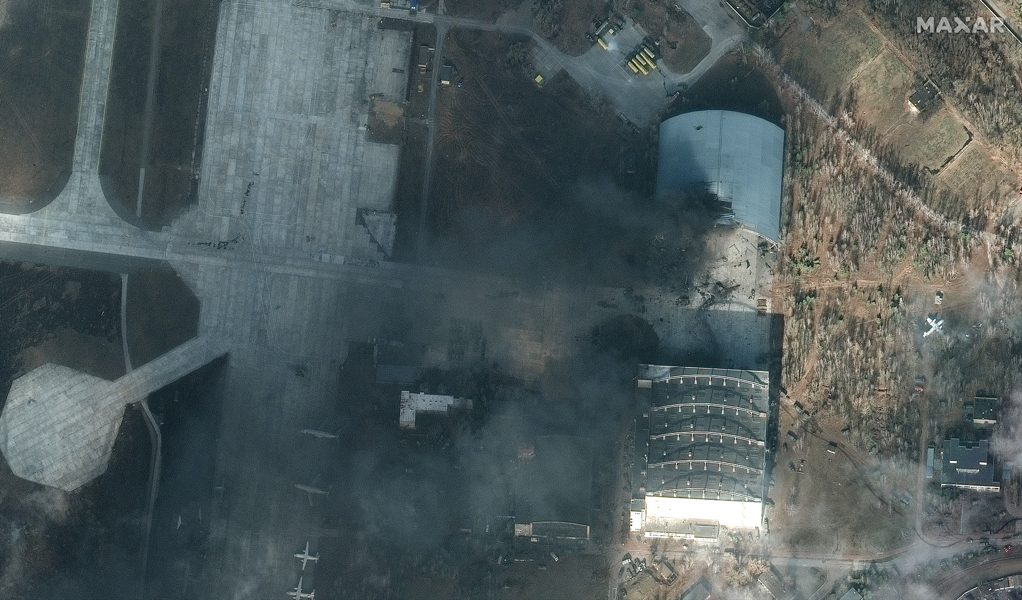 Satellite images from Maxar Technologies show significant damage to part of the hangar at the Hostomel Air Base where the AN-225 is stored.