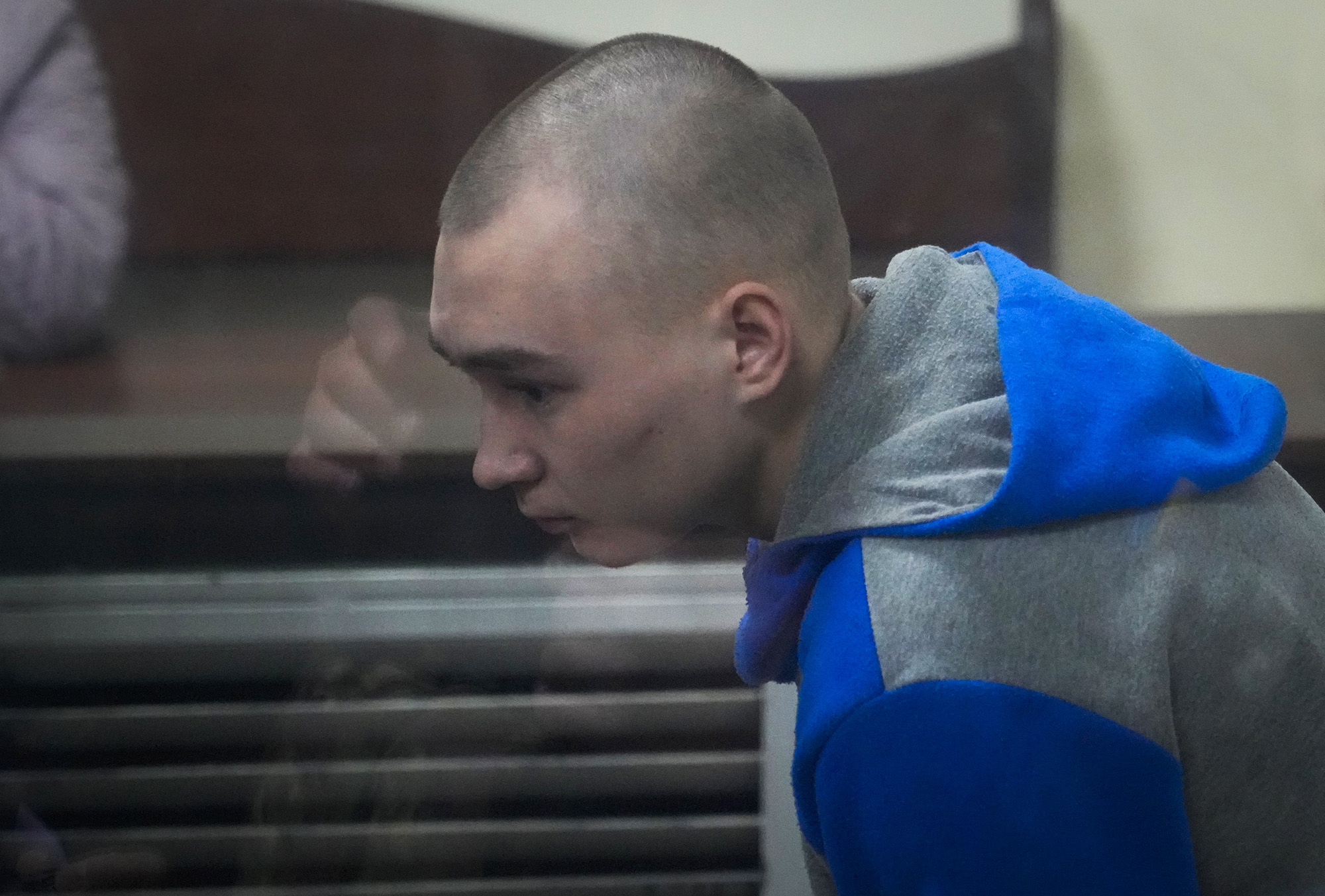 Russian army Sergeant Vadim Shishimarin, 21, is seen behind a glass during a court hearing in Kyiv, Ukraine, on May 18.
