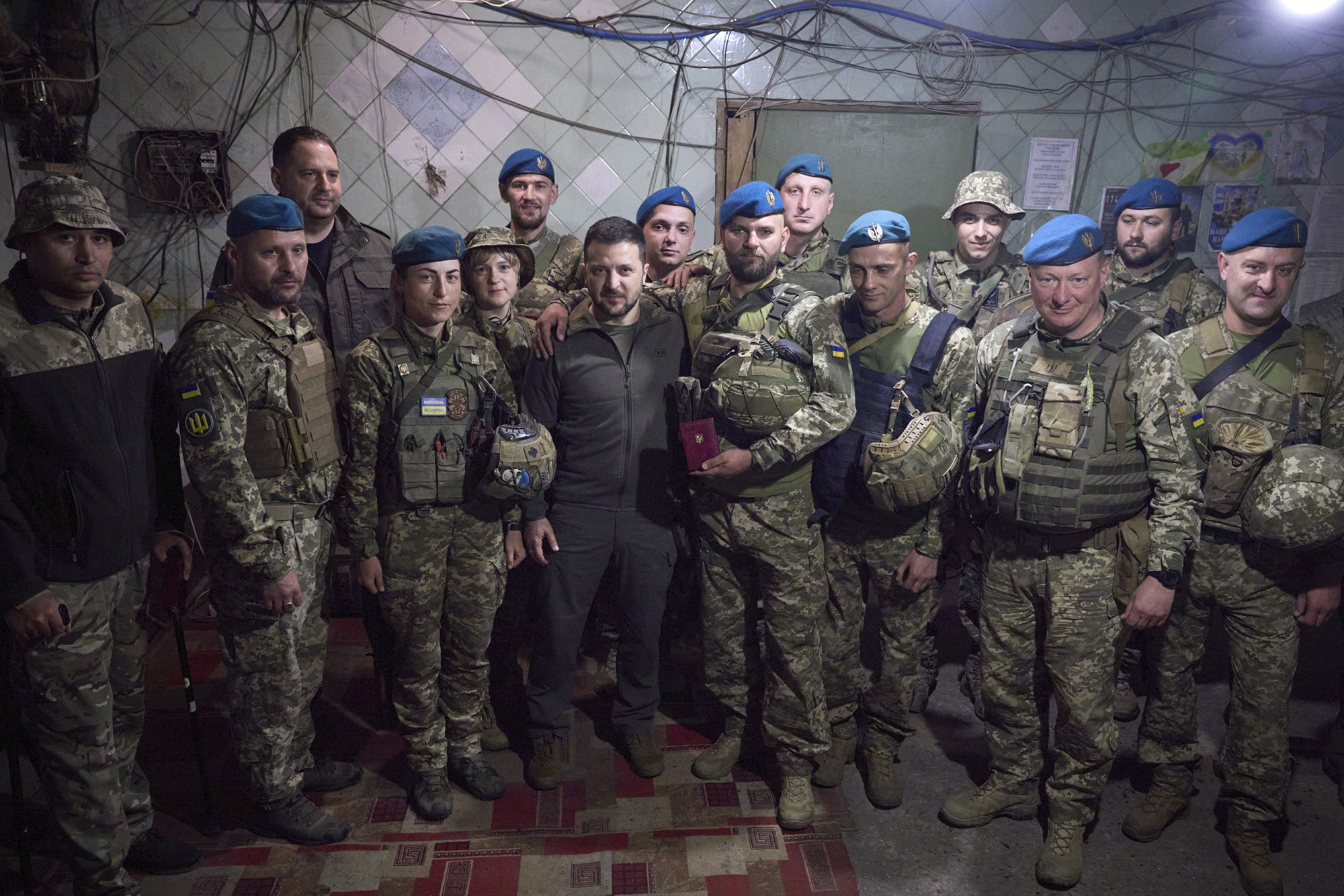 In this photo provided by the Ukrainian Presidential Press Office, Ukrainian president Volodymyr Zelensky, center, poses for photo with soldiers after an awarding ceremony as he visits the Donetsk region, Ukraine, on May 23.