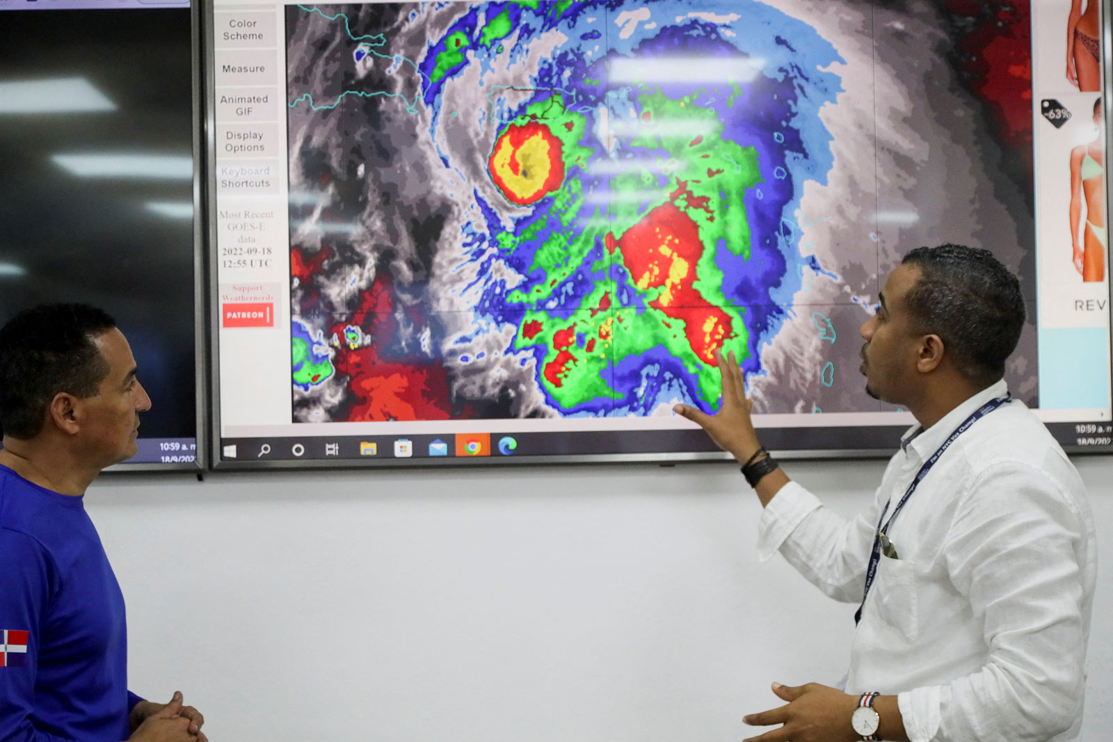 Members of the Emergency Operations Committee (COE) monitor the trajectory of Hurricane Fiona in Santo Domingo, Dominican Republic, on Sunday.