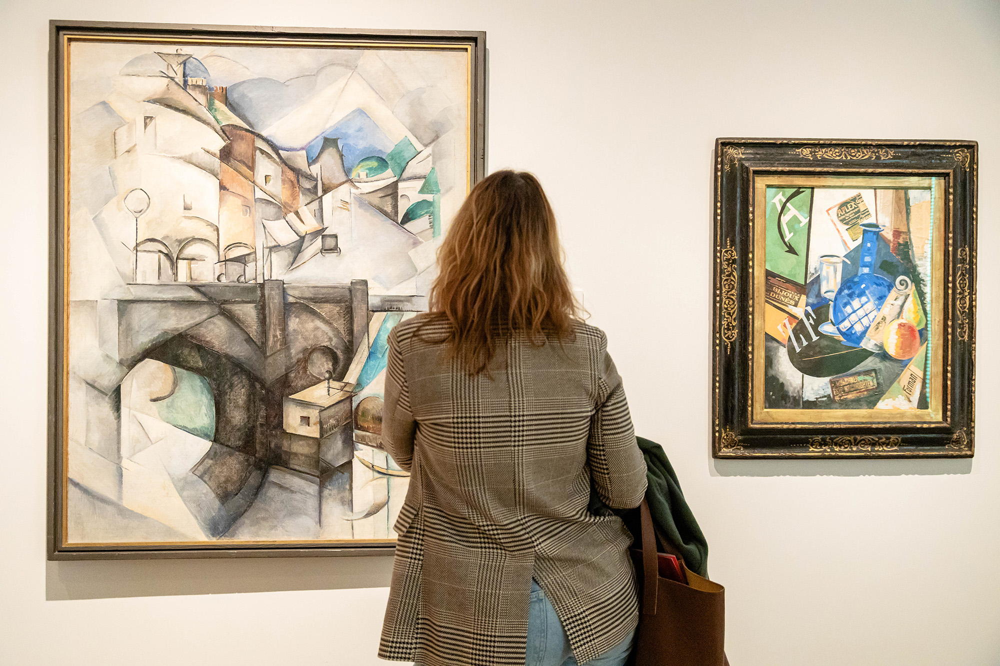  A woman looks at one of the works in the exhibition 'In the Eye of the Storm', at the Museo Nacional Thyssen-Bornemisza, on November 28, in Madrid, Spain.