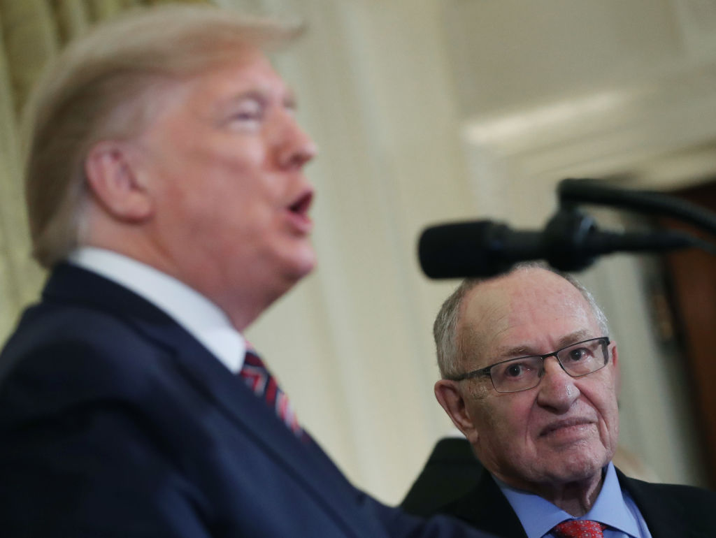 Alan Dershowitz listens to President  Trump speak during a Hanukkah Reception in the East Room of the White House on December 11, 2019.