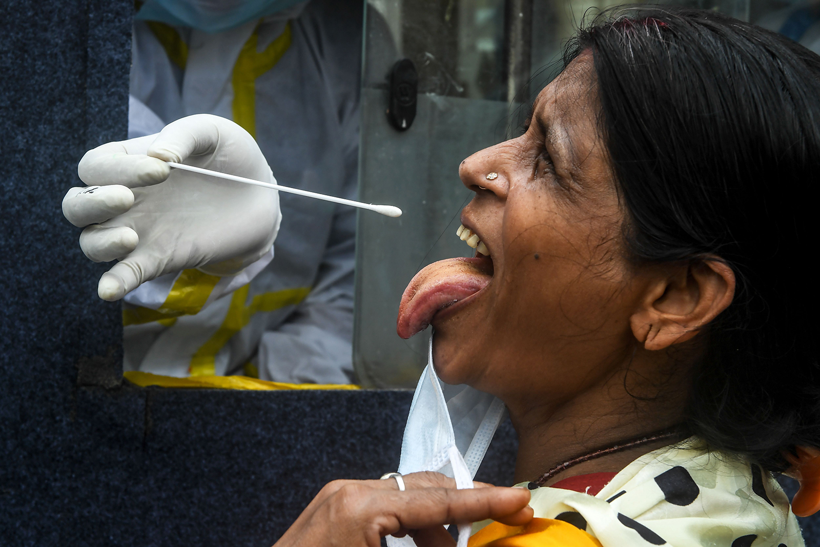 A  health worker collects a swab sample for Covid-19 in Kolkata on July 1.