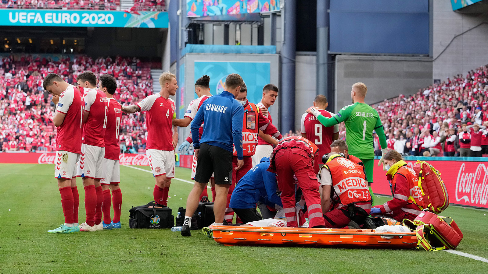 Christian Eriksen receives medical treatment on the pitch at Euro 2020 in Denmark.