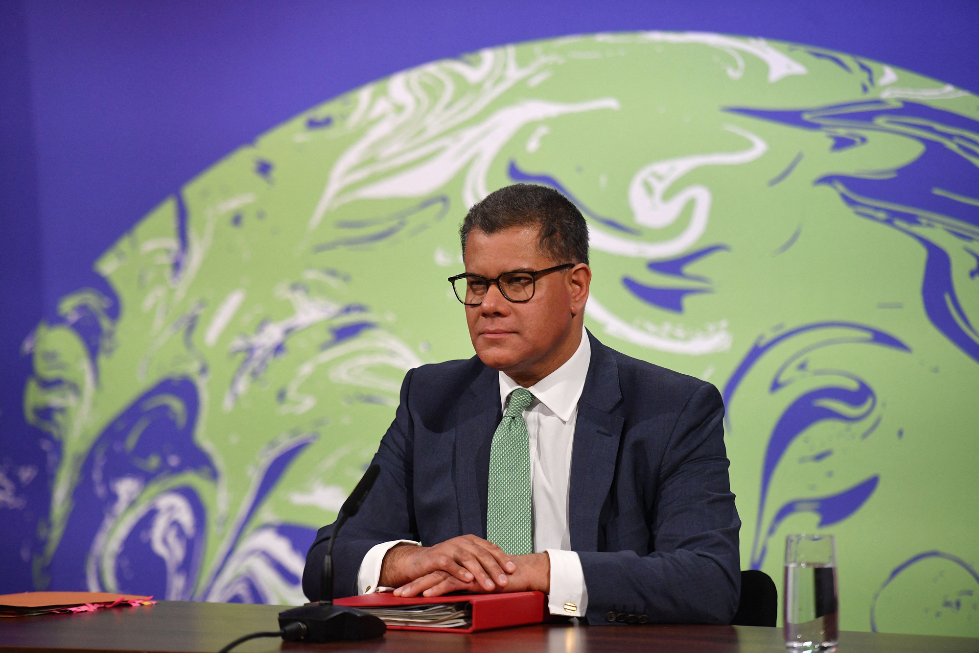 Britain's President for COP26 Alok Sharma listens to a speech from the virtual US Leaders Summit on Climate in the Downing Street Briefing Room in London on April 22.