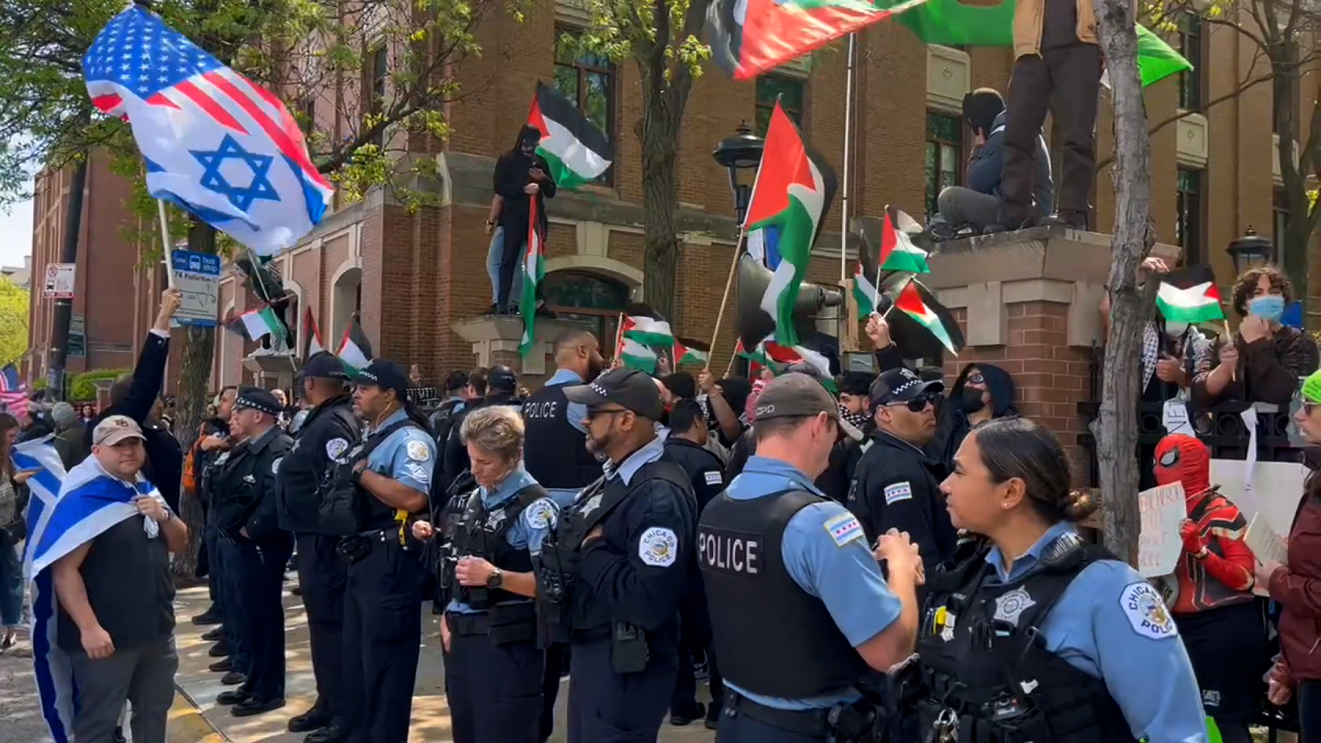 This screen grab from video shot by CNN shows police, protesters and counter-protesters at DePaul University in Chicago on May 5.