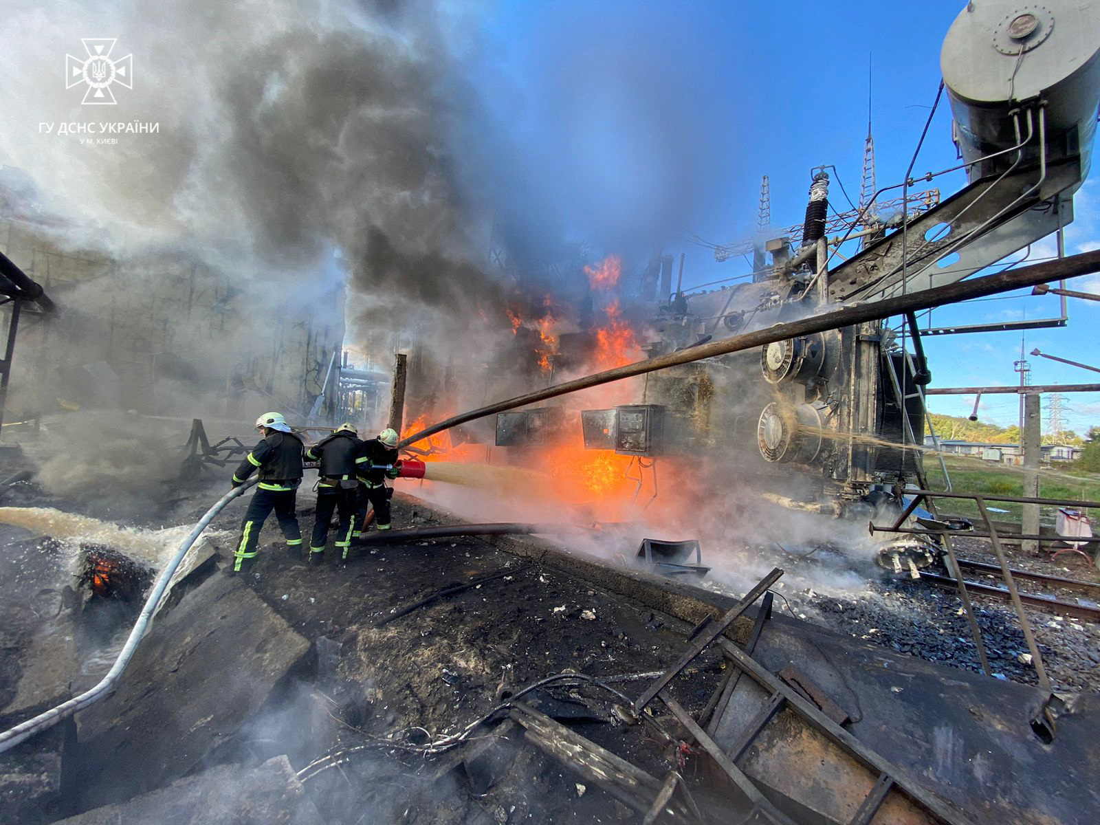 Firefighters work at the site of damaged infrastructure after a Russian missile strike in Kyiv, Ukraine, on October 10.