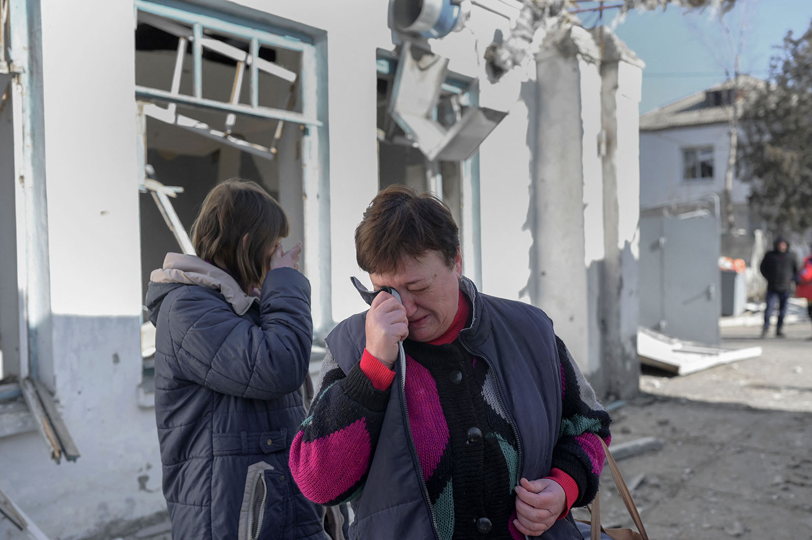 Nurses cry after seeing the damage sustained by a psychiatric hospital hit by Russian shelling in Mykolaiv on March 22. 