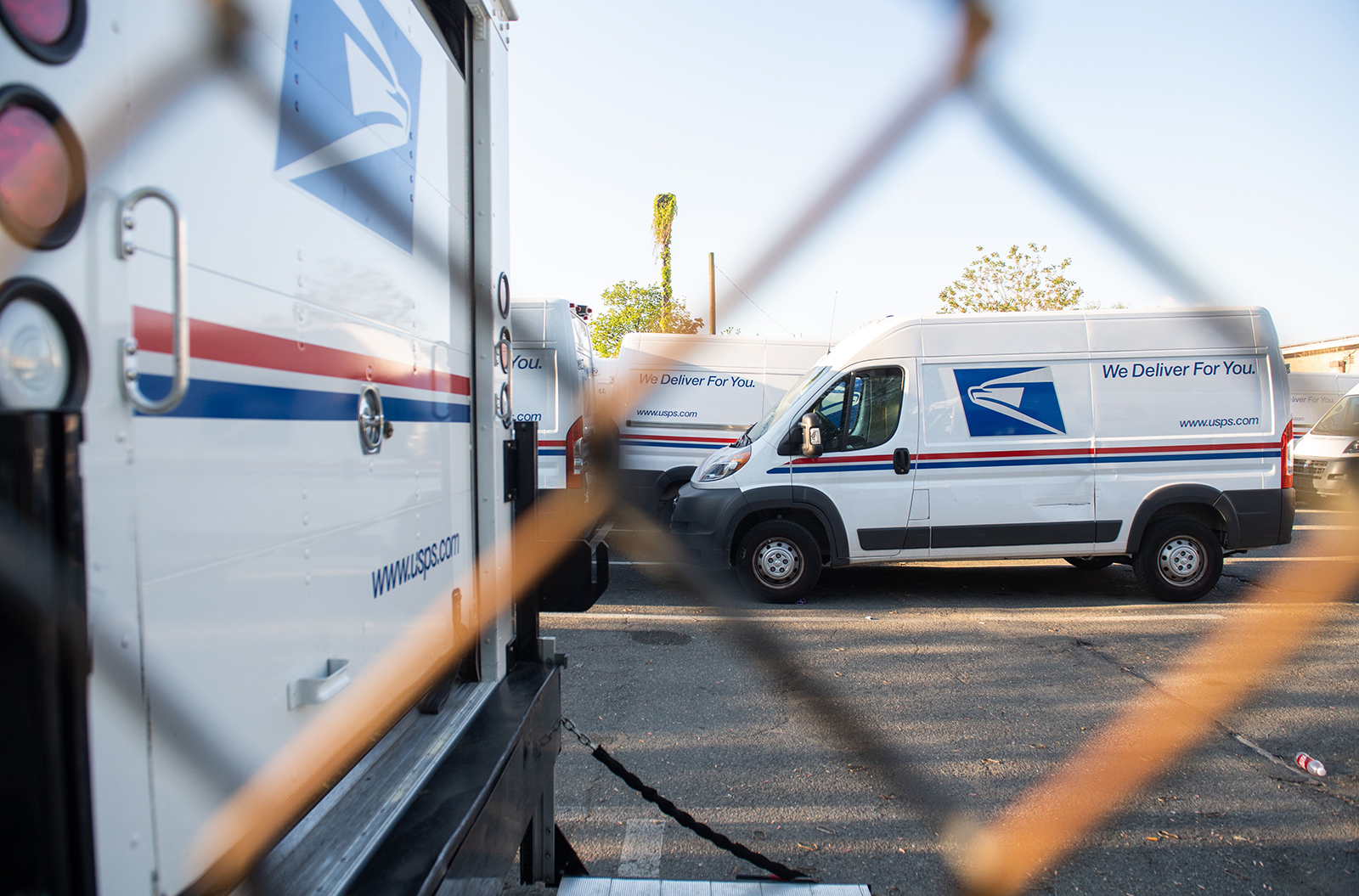 Postal trucks are parked at a United States Postal Service post office in Washington, DC, on April 16.