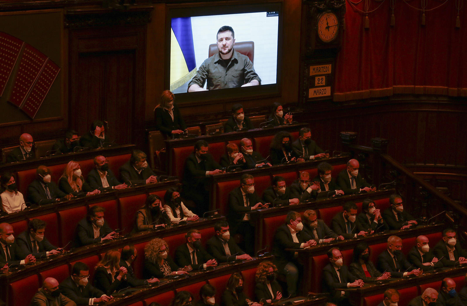 Members of the Italian Parliament and government listen to Ukraine President Volodymyr Zelensky during his virtual address to the parliament in Rome, Italy on March 22.