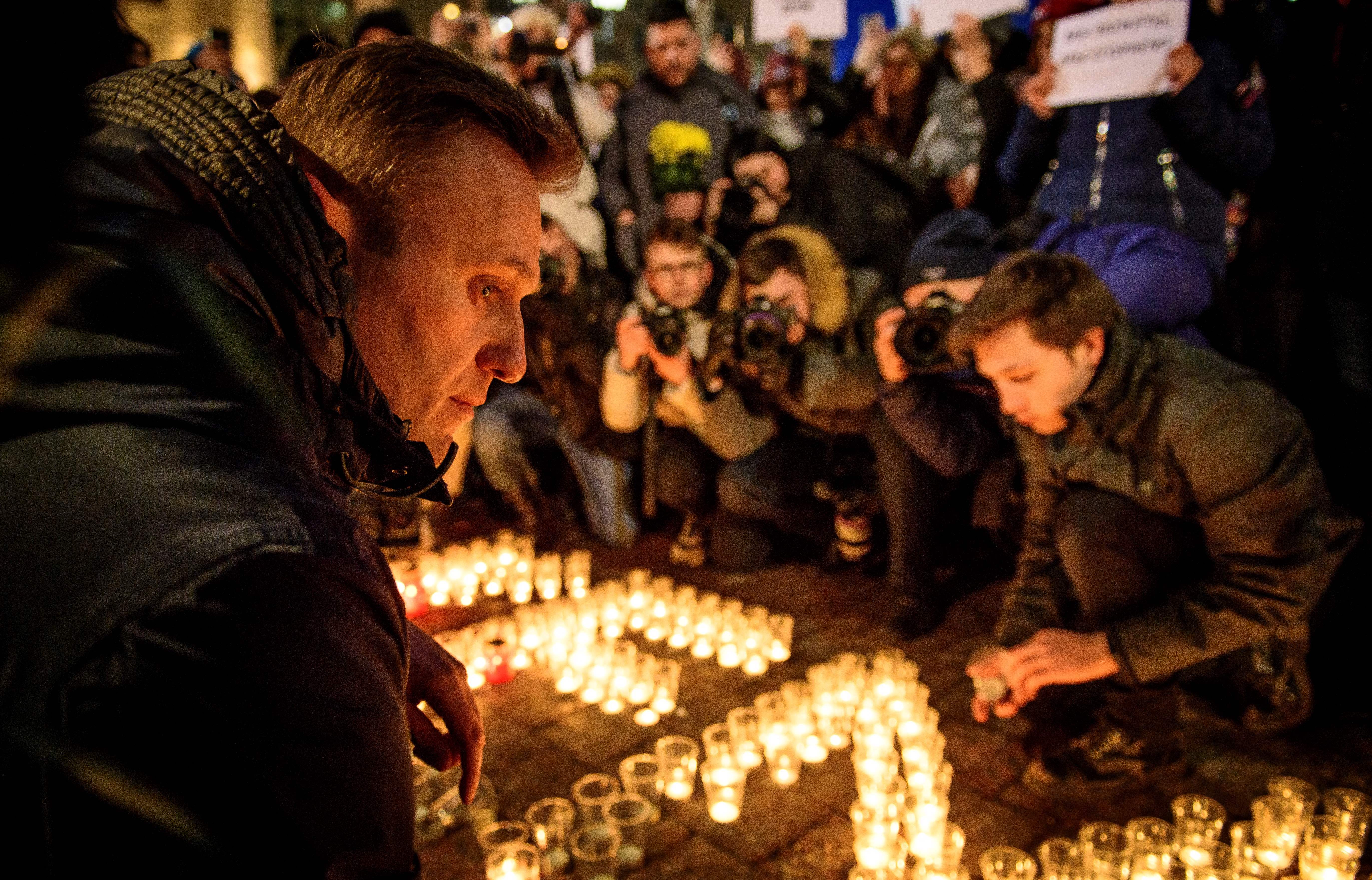 Navalny, along with other opposition supporters in Moscow, pays tribute to the victims of a shopping mall fire in Siberia in March 2018.