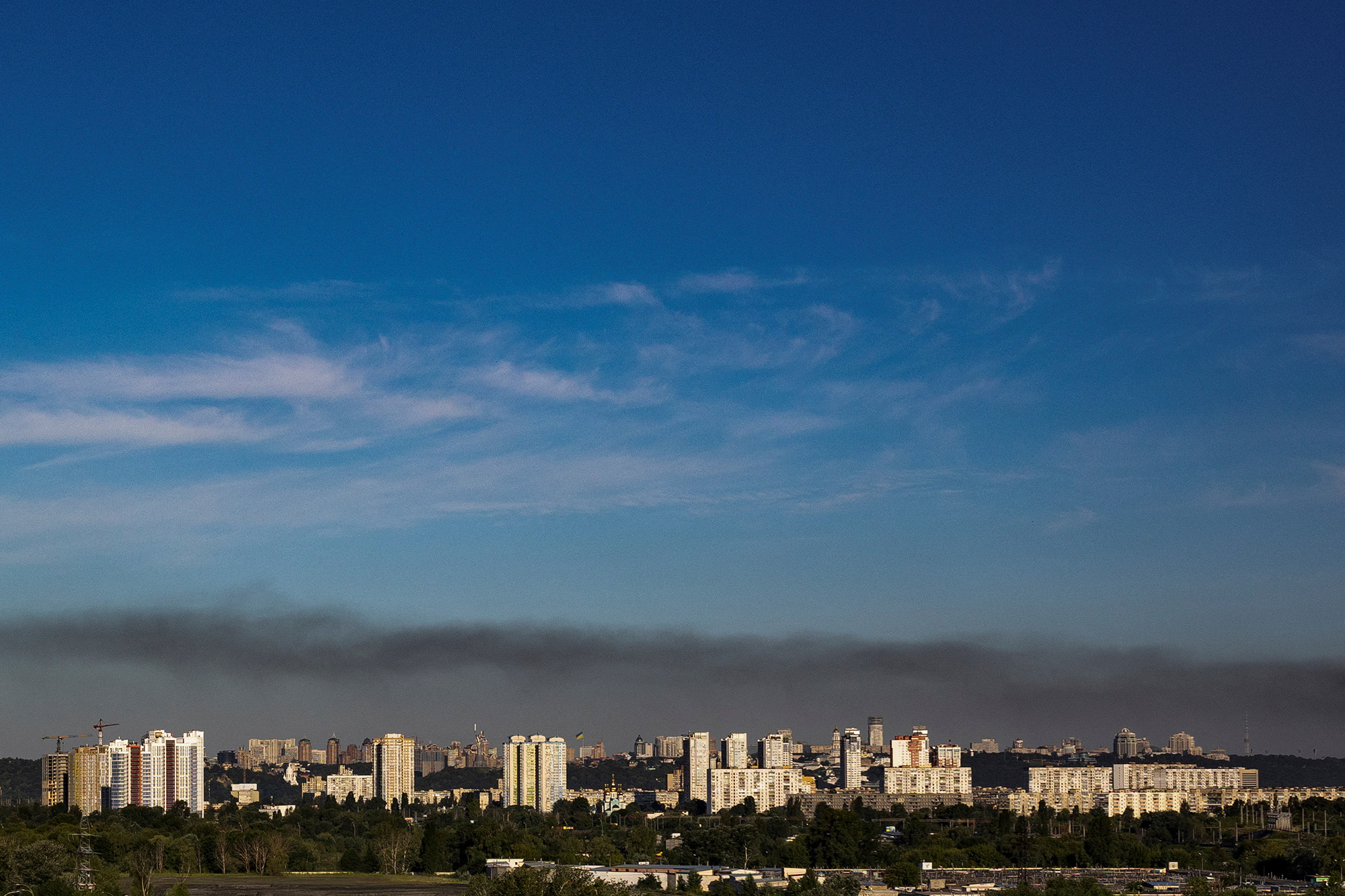Smoke rises over the city skyline after Russian missile strikes on the Ukrainian capital in Kyiv, Ukraine, on July 28.