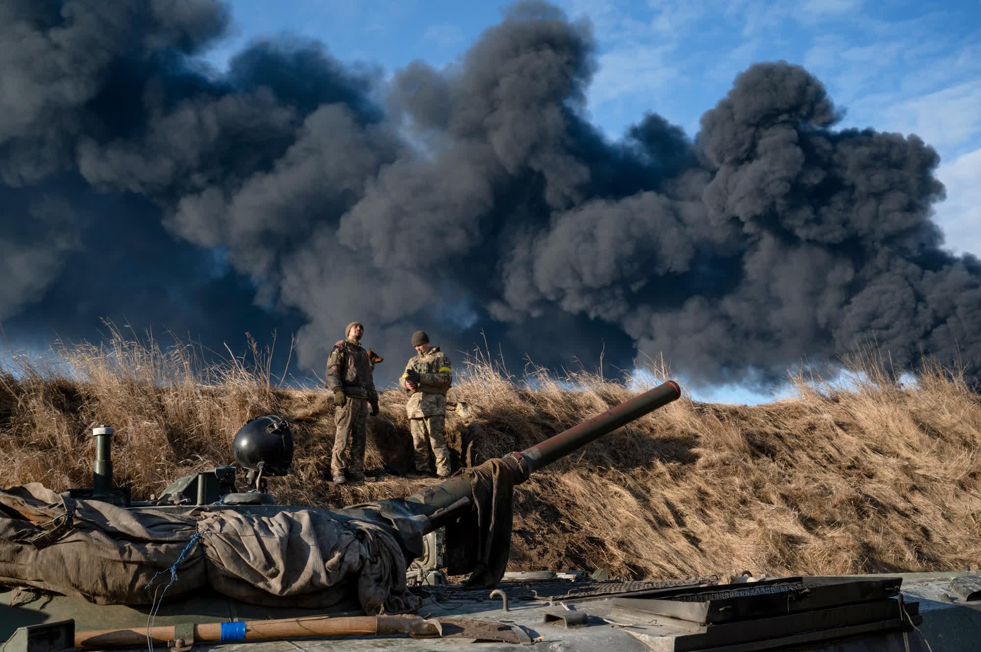 Ukrainian soldiers are seen after an attack at the Vasylkiv Air Base near Kyiv, two days after Russia invaded. This photo was taken by Maks Levin, a Ukrainian photojournalist who was killed by Russian forces in March 2022, according to the office of Ukraine’s attorney general. “Every Ukrainian photographer dreams of taking the photo that will stop the war,” Levin said.