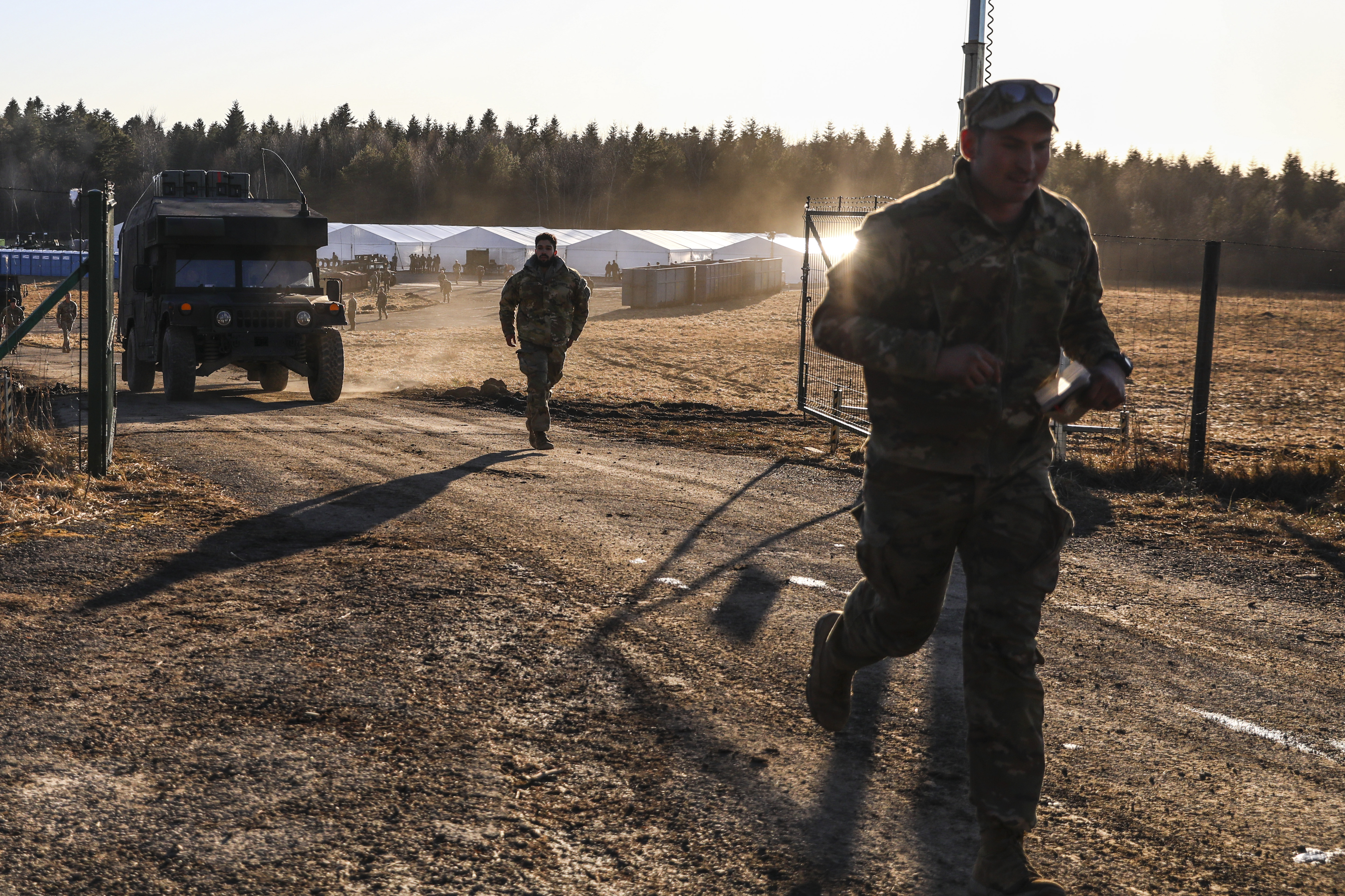 US soldiers of the 82nd Airborne Division and military vehicles are seen at a temporary base in Wola Korzeniecka, Poland on February 24. 