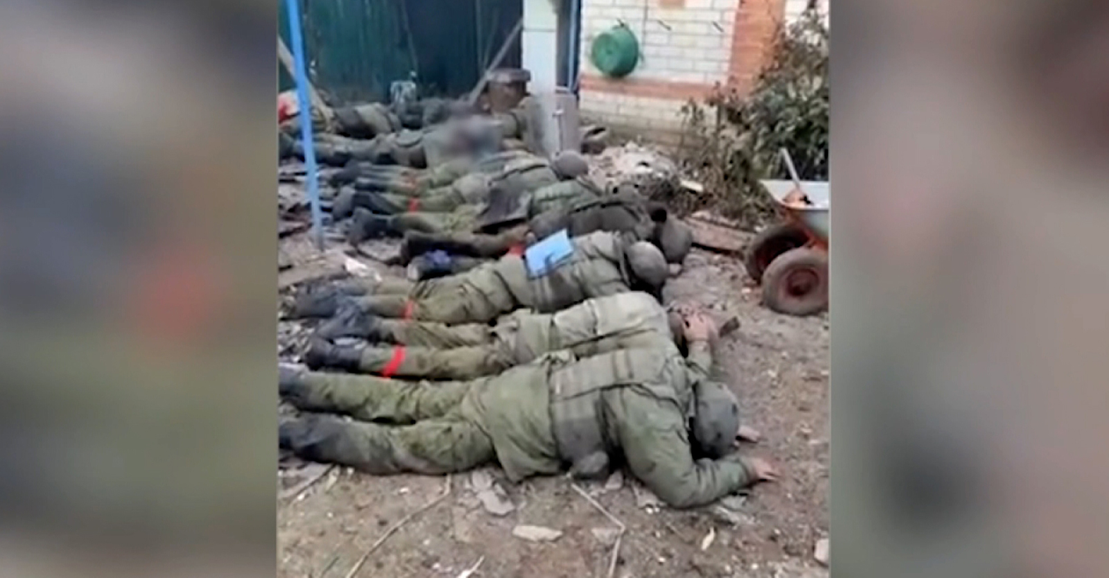 The edited video purports to show captured Russian soldiers in an act of surrender, with several men lying on the ground on their fronts with their hands over their heads. 