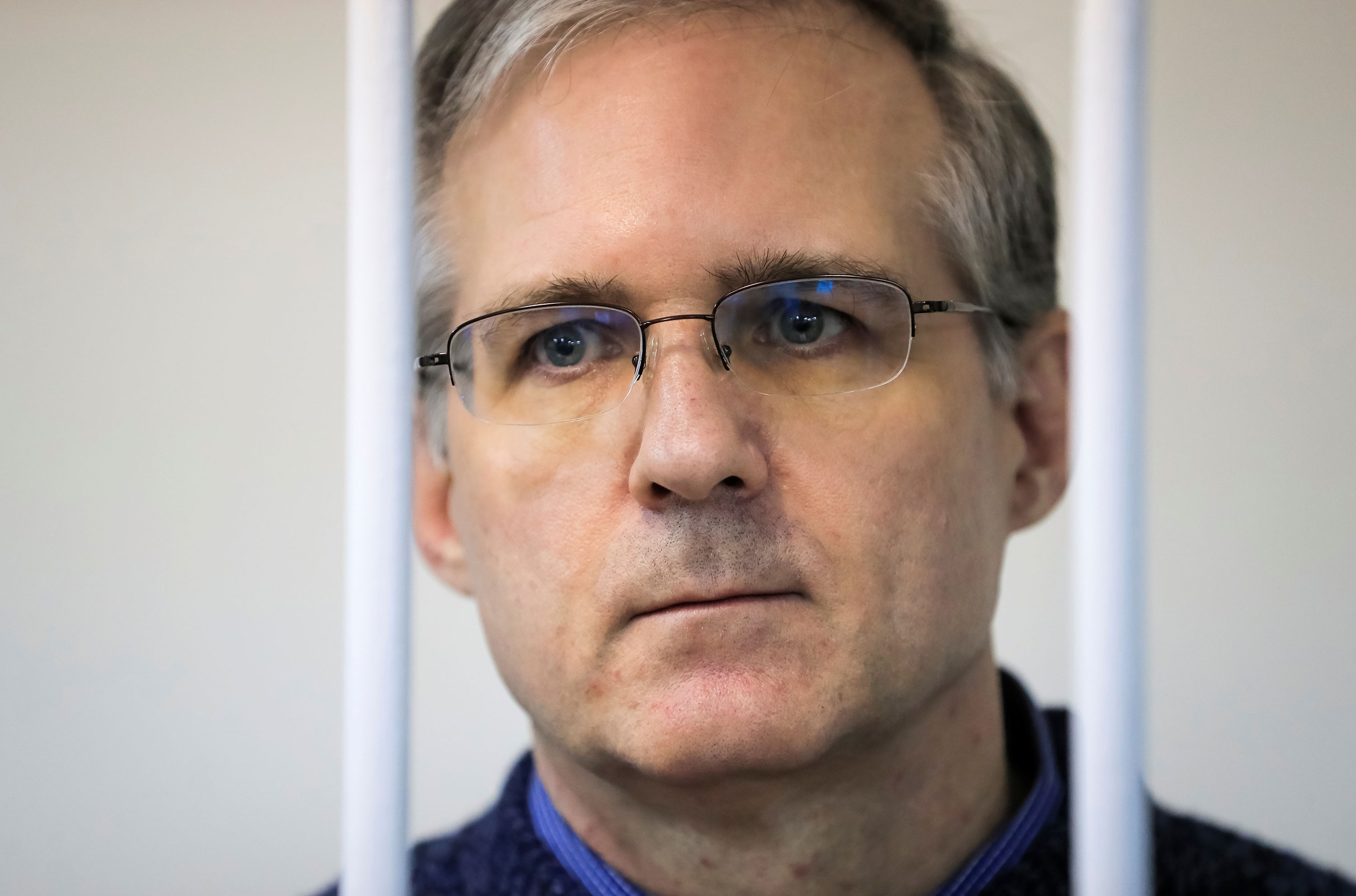 Paul Whelan stands inside a defendants' cage during a court hearing in Moscow on October 24, 2019. 