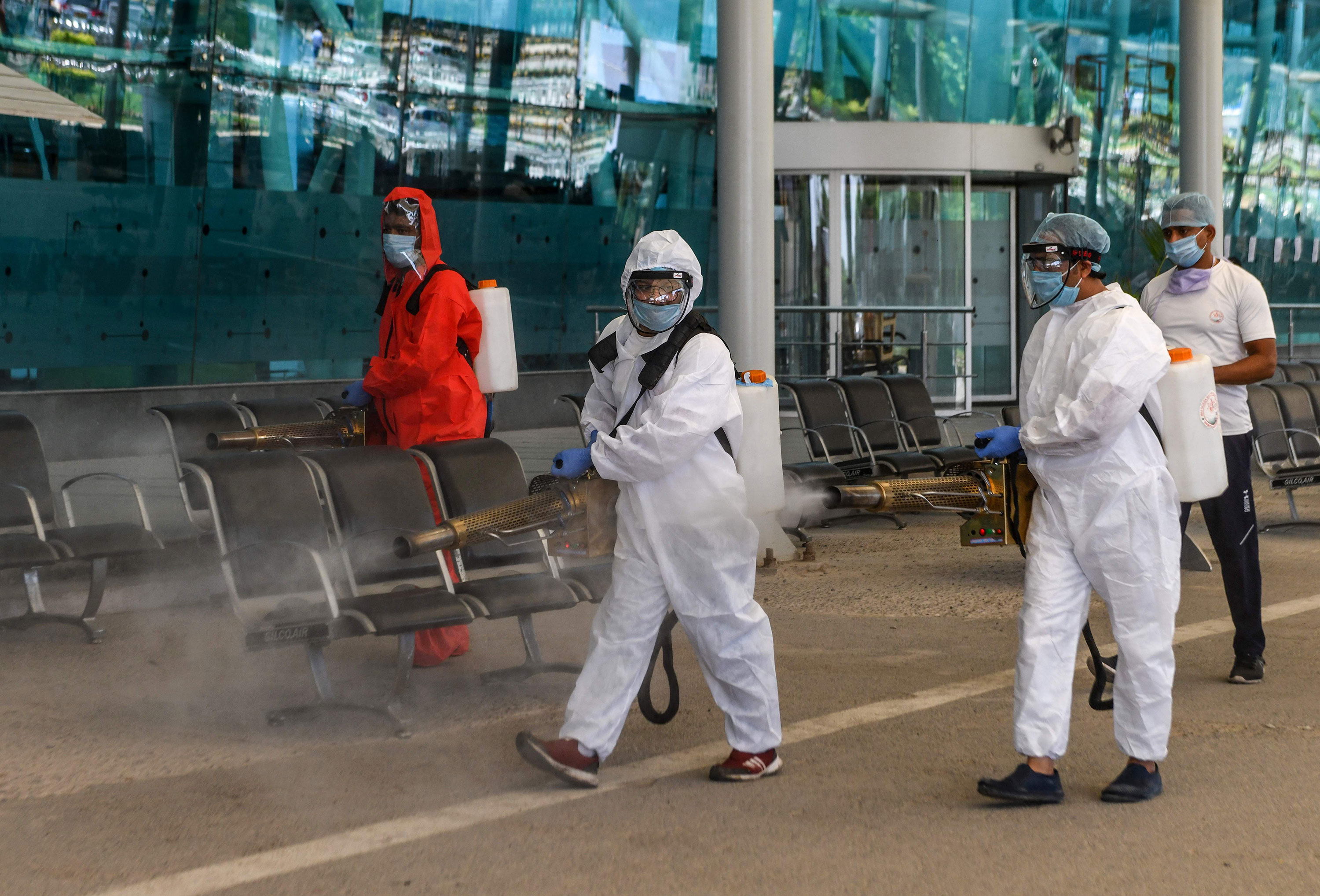 Volunteers spray disinfectant at Sri Guru Ram Dass Jee International Airport in Amritsar, India, on May 15.
