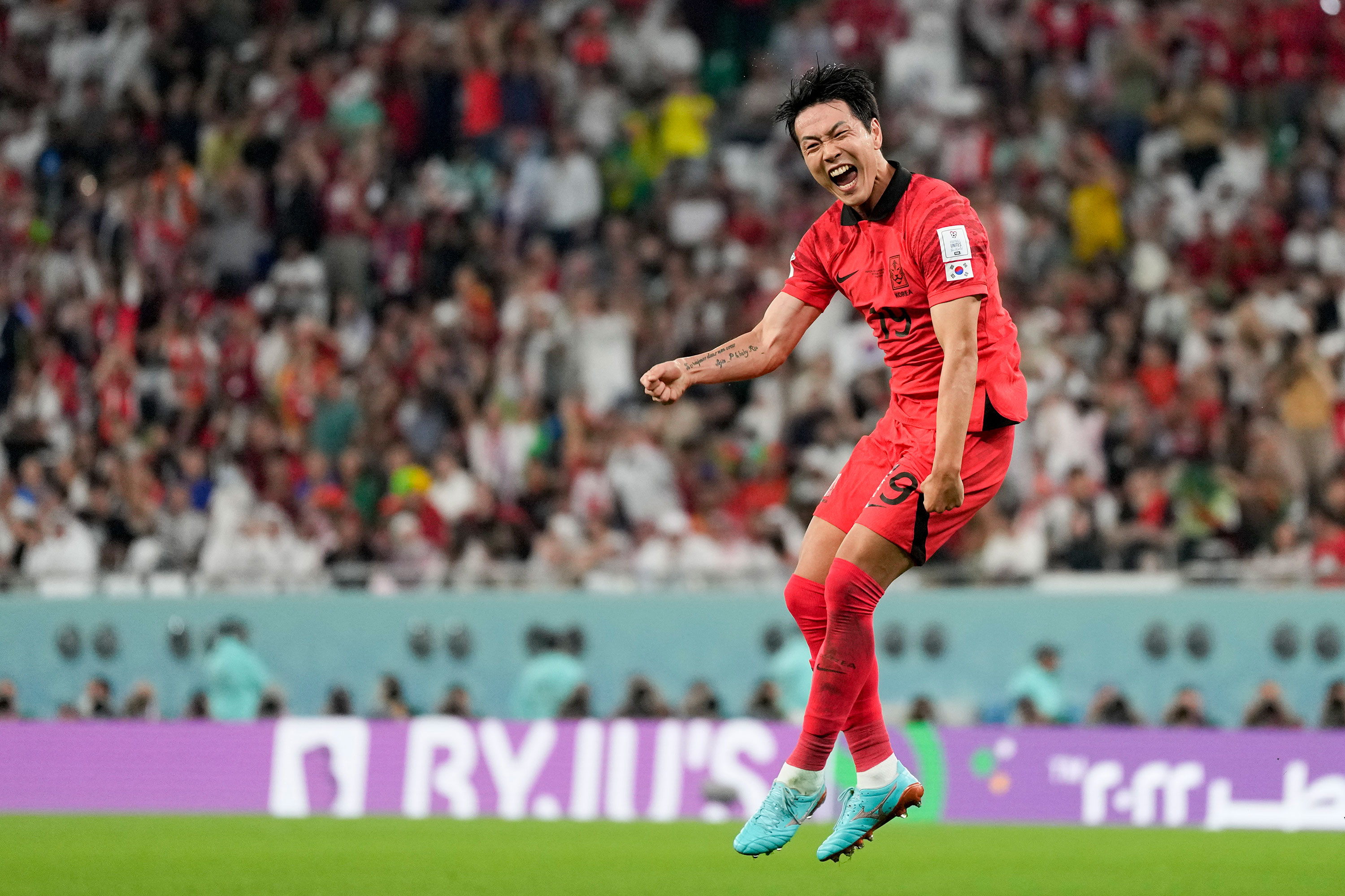 South Korea's Kim Young-gwon celebrates scoring his team's first goal on Friday.