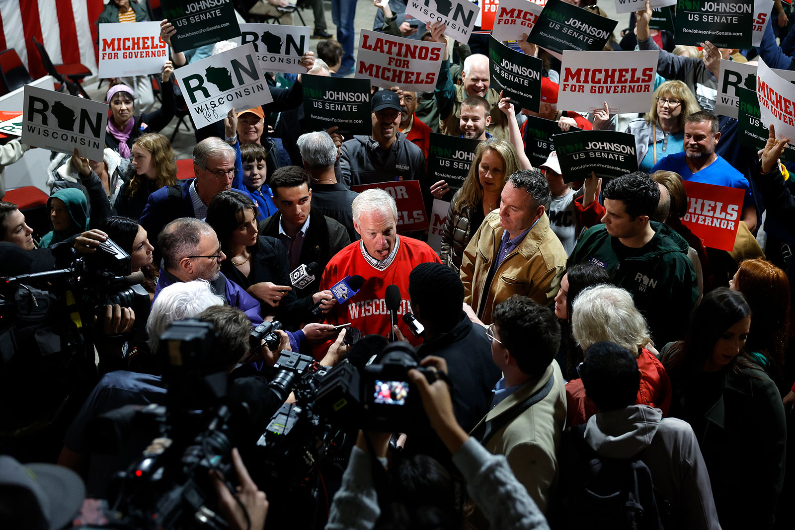 Sen. Ron Johnson and Republican nominee for governor in Wisconsin Tim Michels speak with reporters during a campaign event in Waukesha, Wisconsin Saturday. 