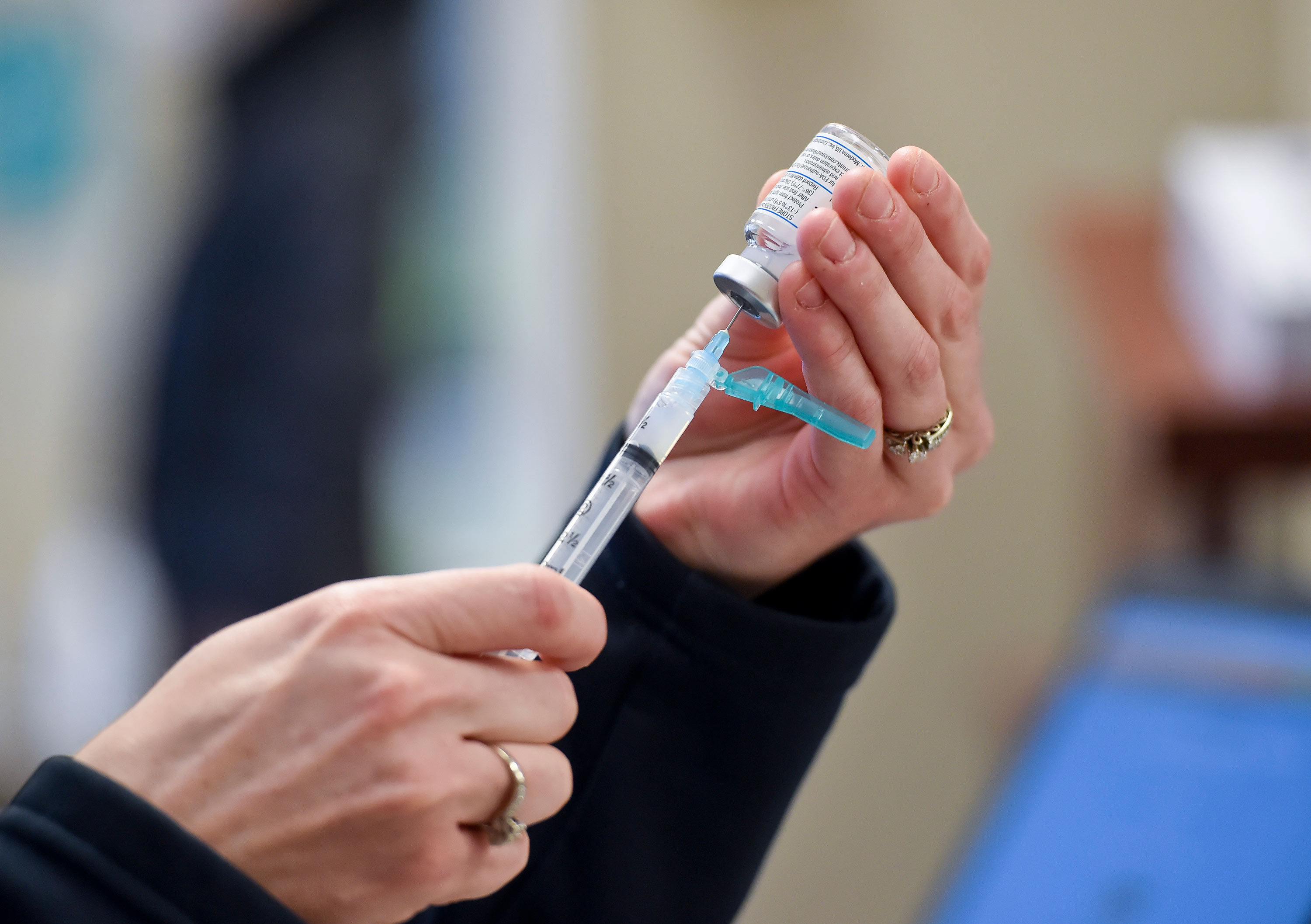 A syringe is filled with a dose of the Moderna COVID-19 vaccine at the Berks Community Health Center in Reading, Pennsylvania, on January 6.