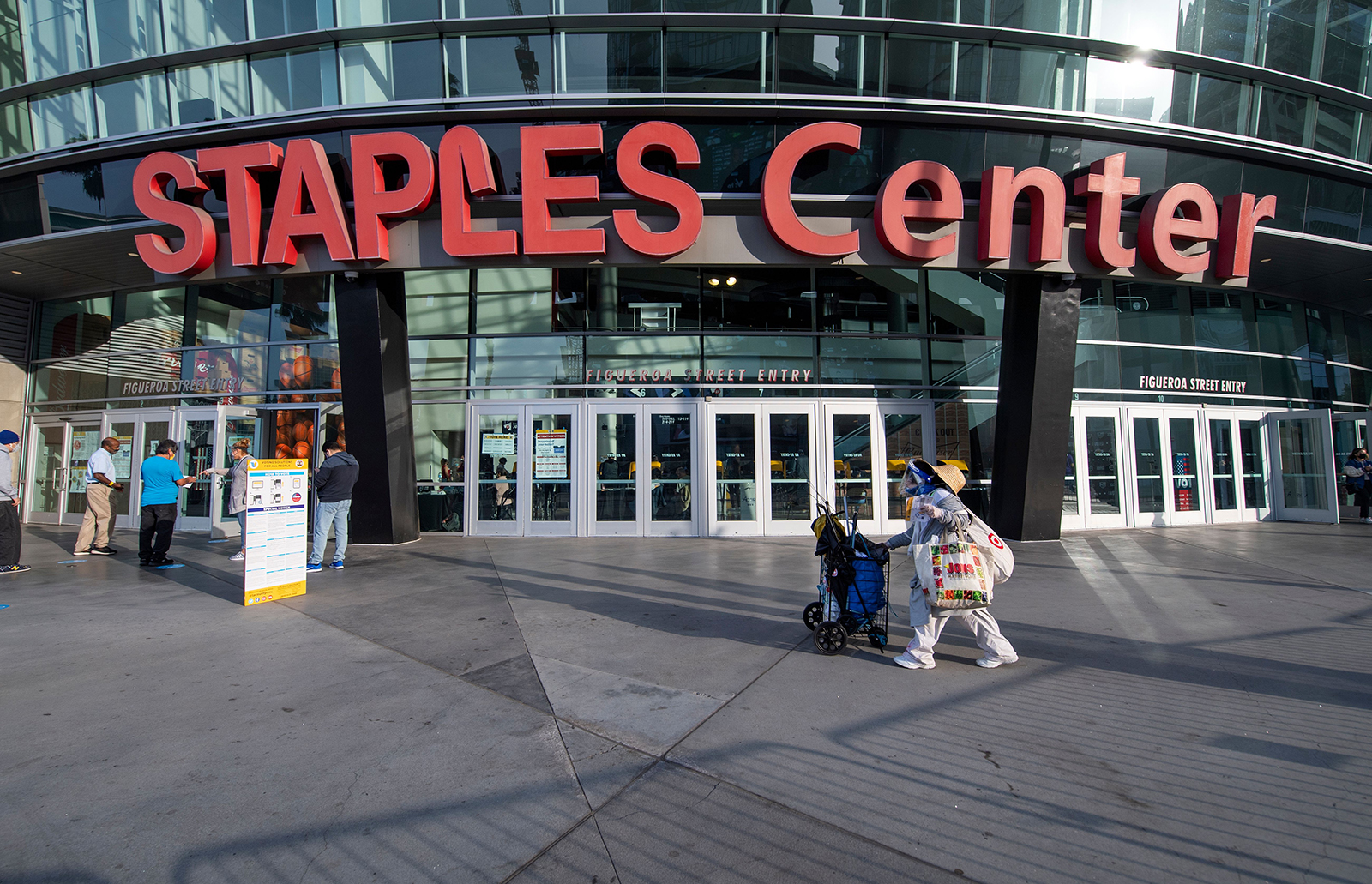 A voter arrives at the Staples Center to drop off a ballot during the presidential election on November 3, in Los Angeles.