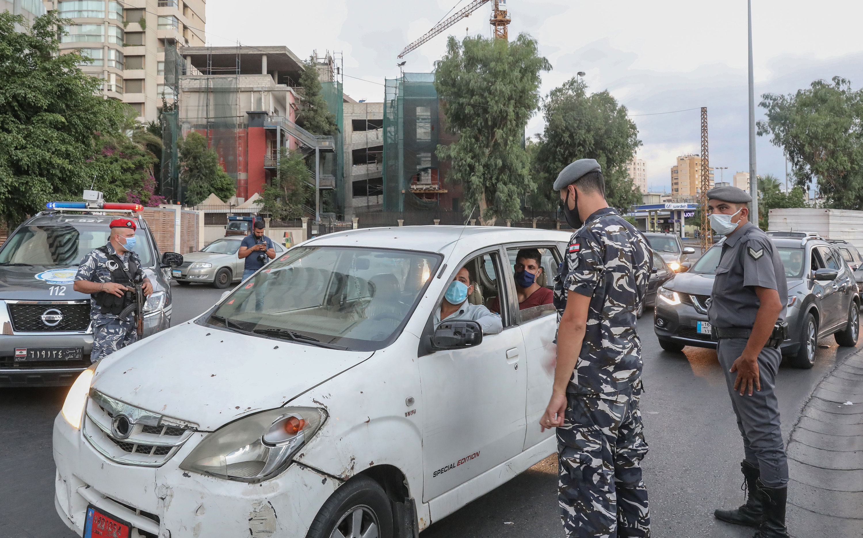 Lebanese security force officers man a checkpoint to verify the compliance with restrictions on the first day of a reinstated lockdown to combat a surge in Covid-19 cases on August 21 in Beirut, Lebanon. 