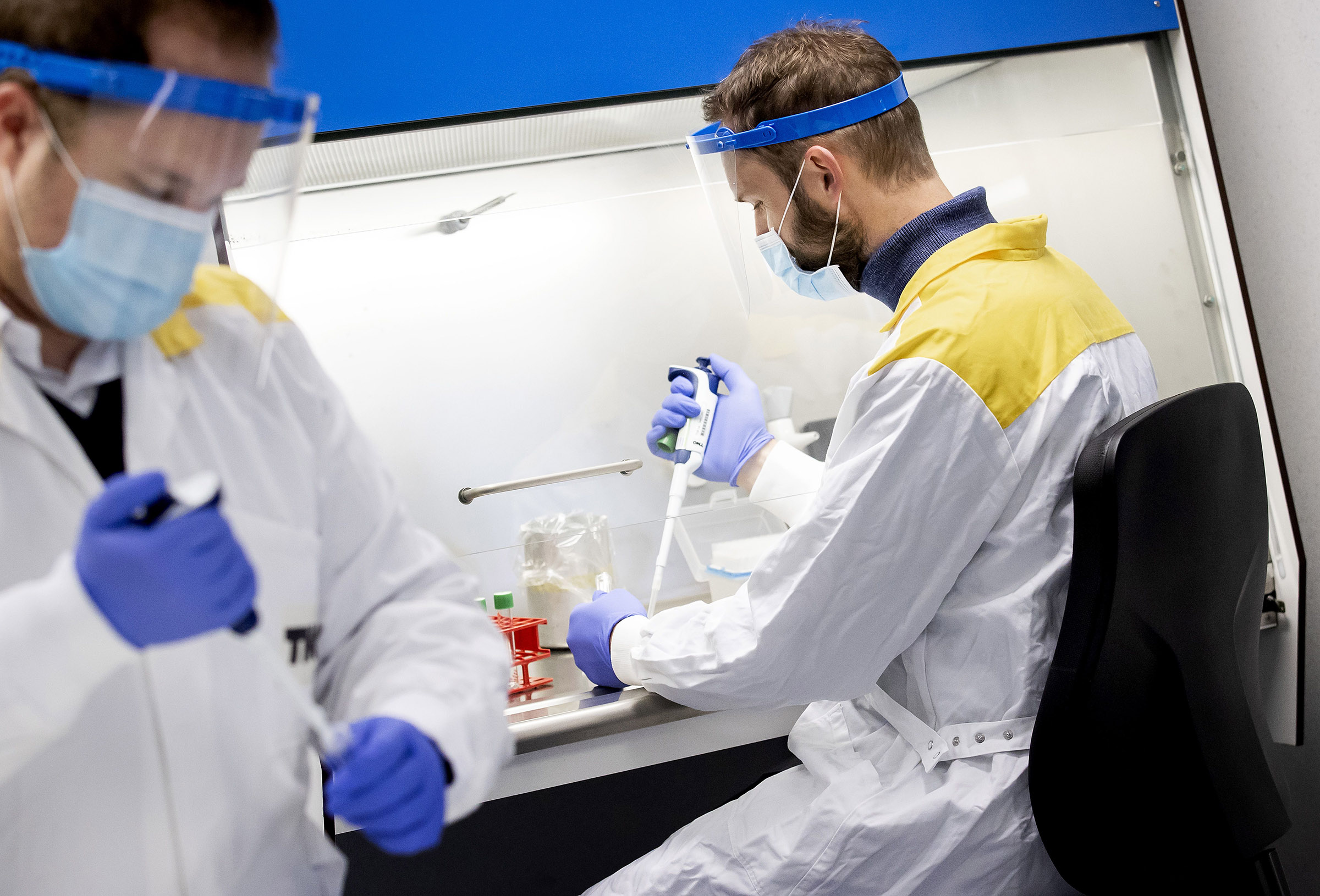 TNO employees work during the opening of a COVID-19 testing site in Amsterdam, on September 30. 