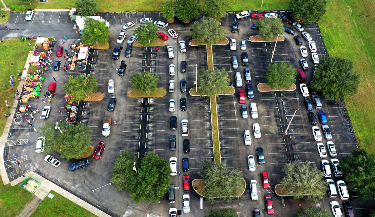 Residents line up in their cars at a food distribution site at Lake-Sumter State College sponsored by the Second Harvest Food Bank of Central Florida and local churches on November 21.