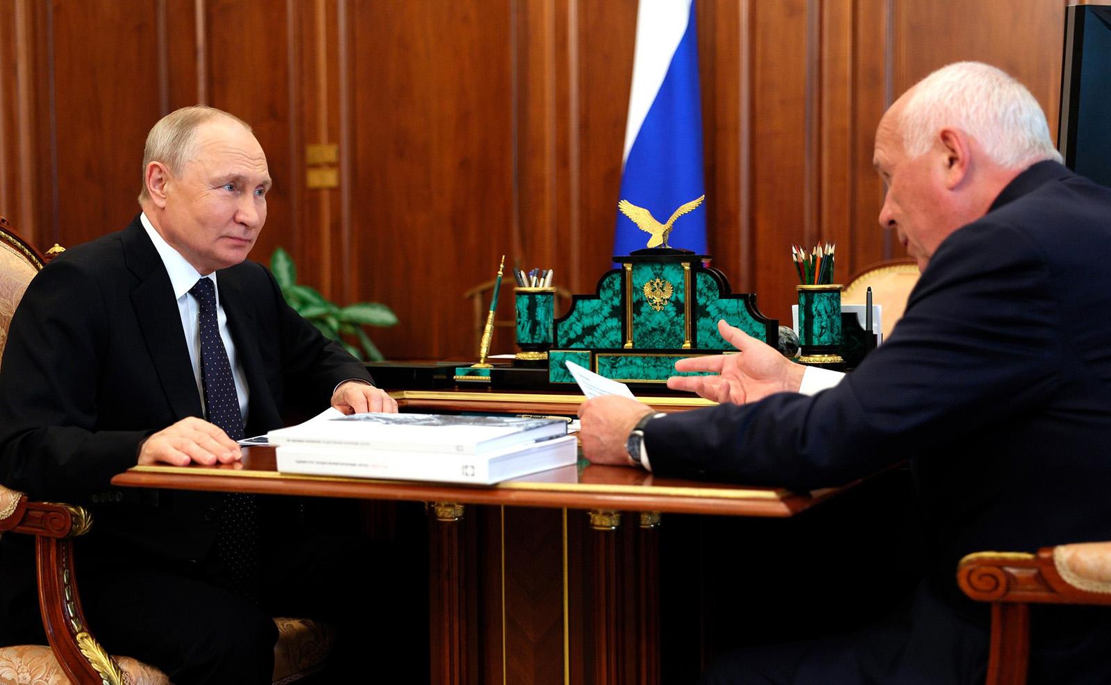 Russian President Vladimir Putin holds a meeting with CEO of Rostec State Corporation Sergei Chemezov at the Kremlin in Moscow, Russia, on August 7.